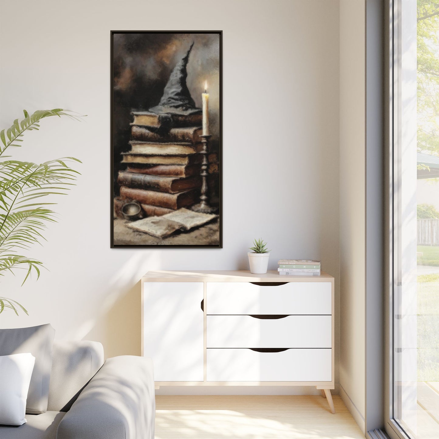 Modern living room with a white cabinet, plant, and framed artwork on the wall.