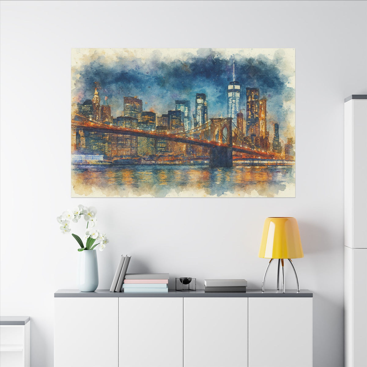 Cityscape painting of a bridge and skyline on a wall above a white cabinet with decor items.