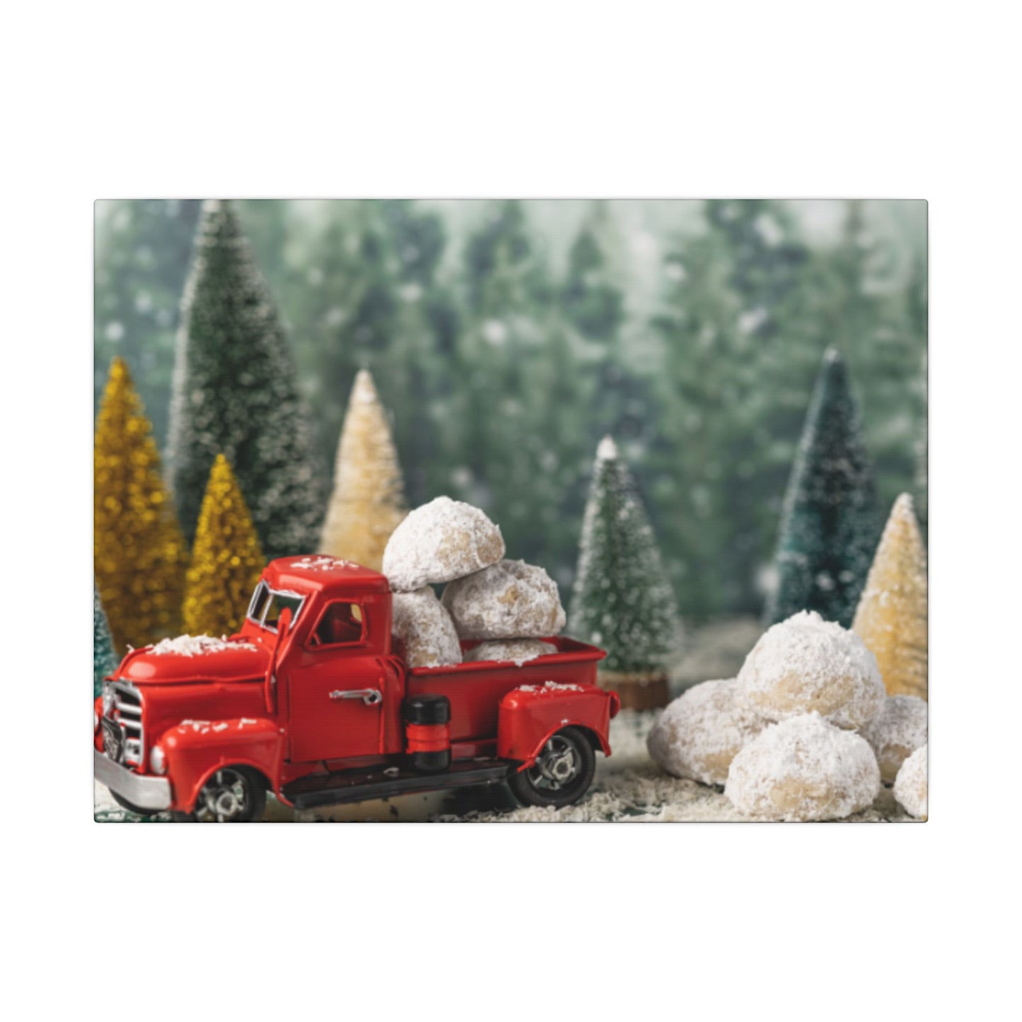 Red toy truck with snow-covered trees in a forest setting