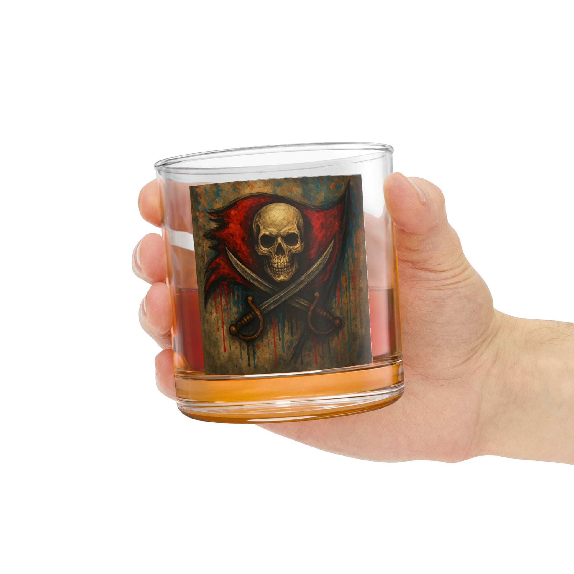 Hand holding a glass with a skull and crossbones design on a white background