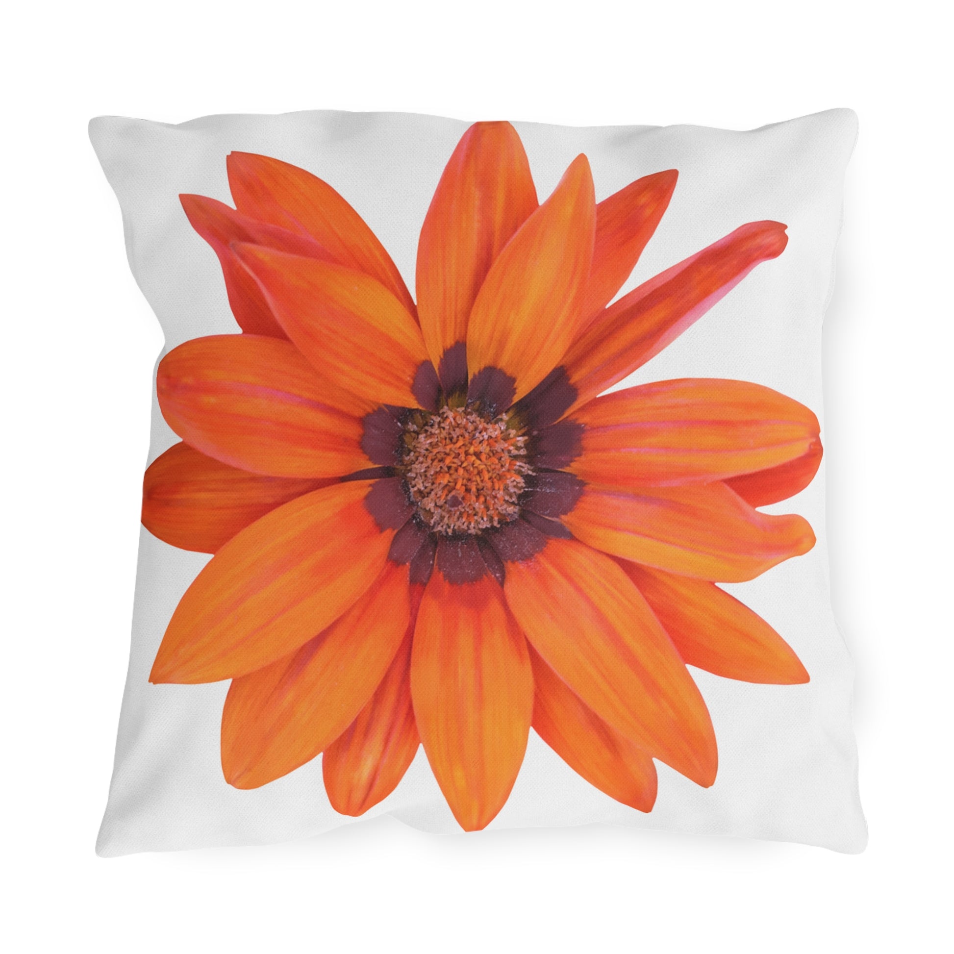 Pillow with a large orange flower design on a white background