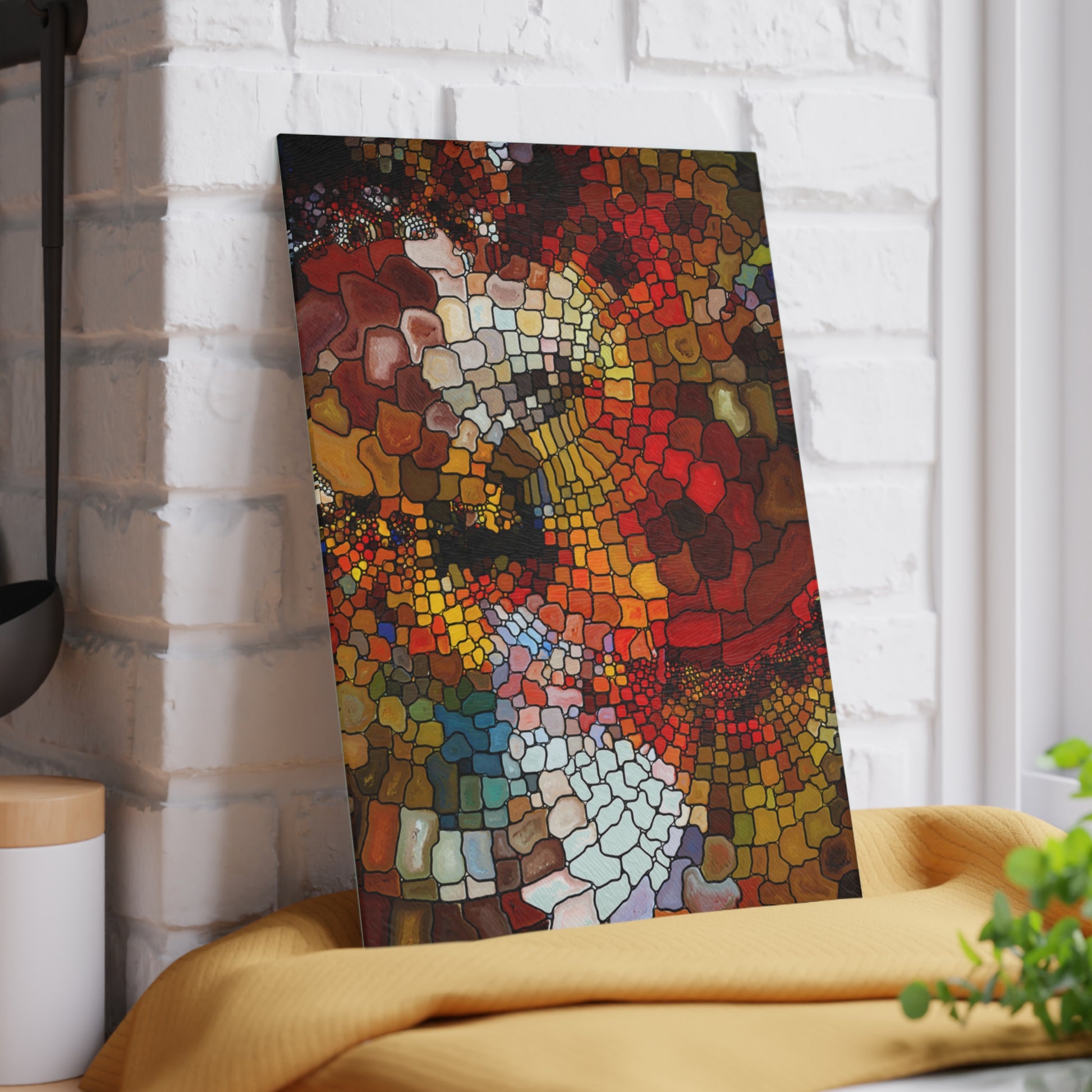 Colorful mosaic art piece on a white brick wall
