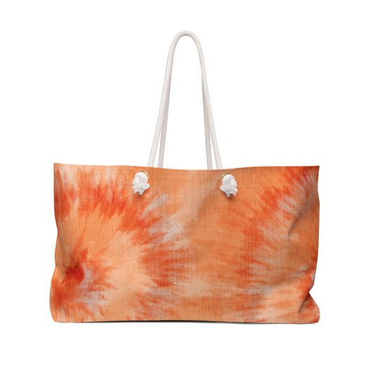 Tie-dye beach bag with white handles on a white background