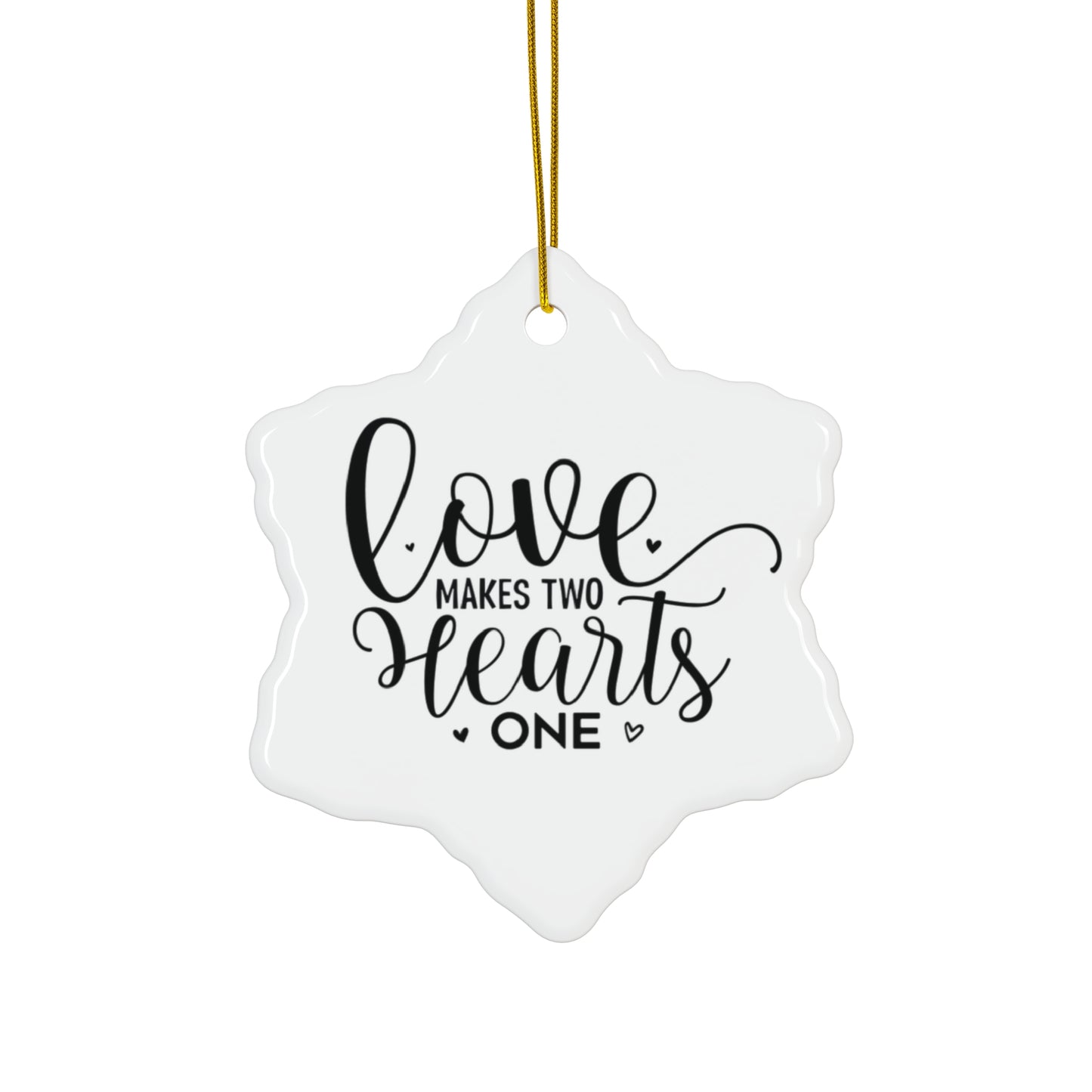 Decorative ornament with 'Love makes two hearts one' text on a white background