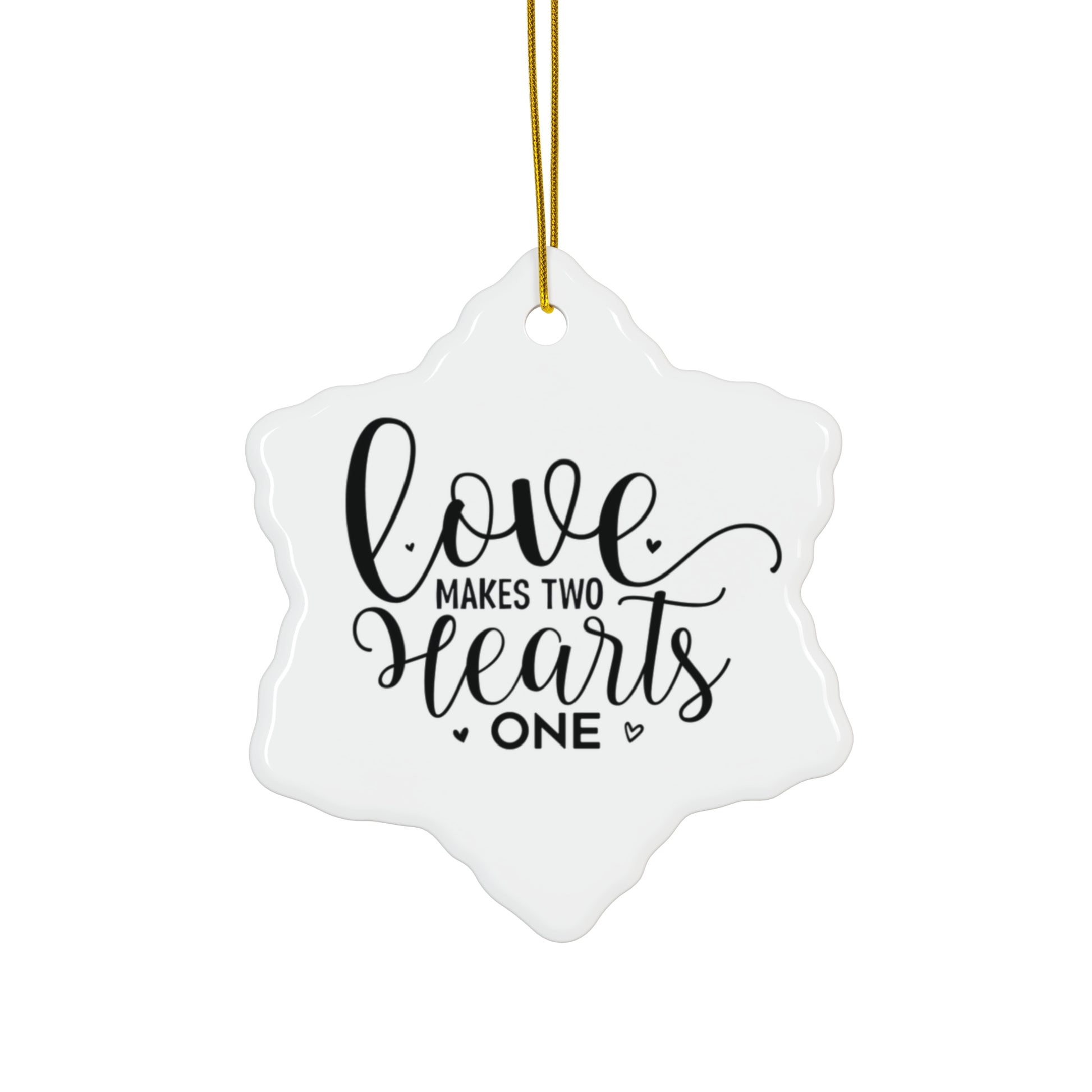 Decorative ornament with 'Love makes two hearts one' text on a white background
