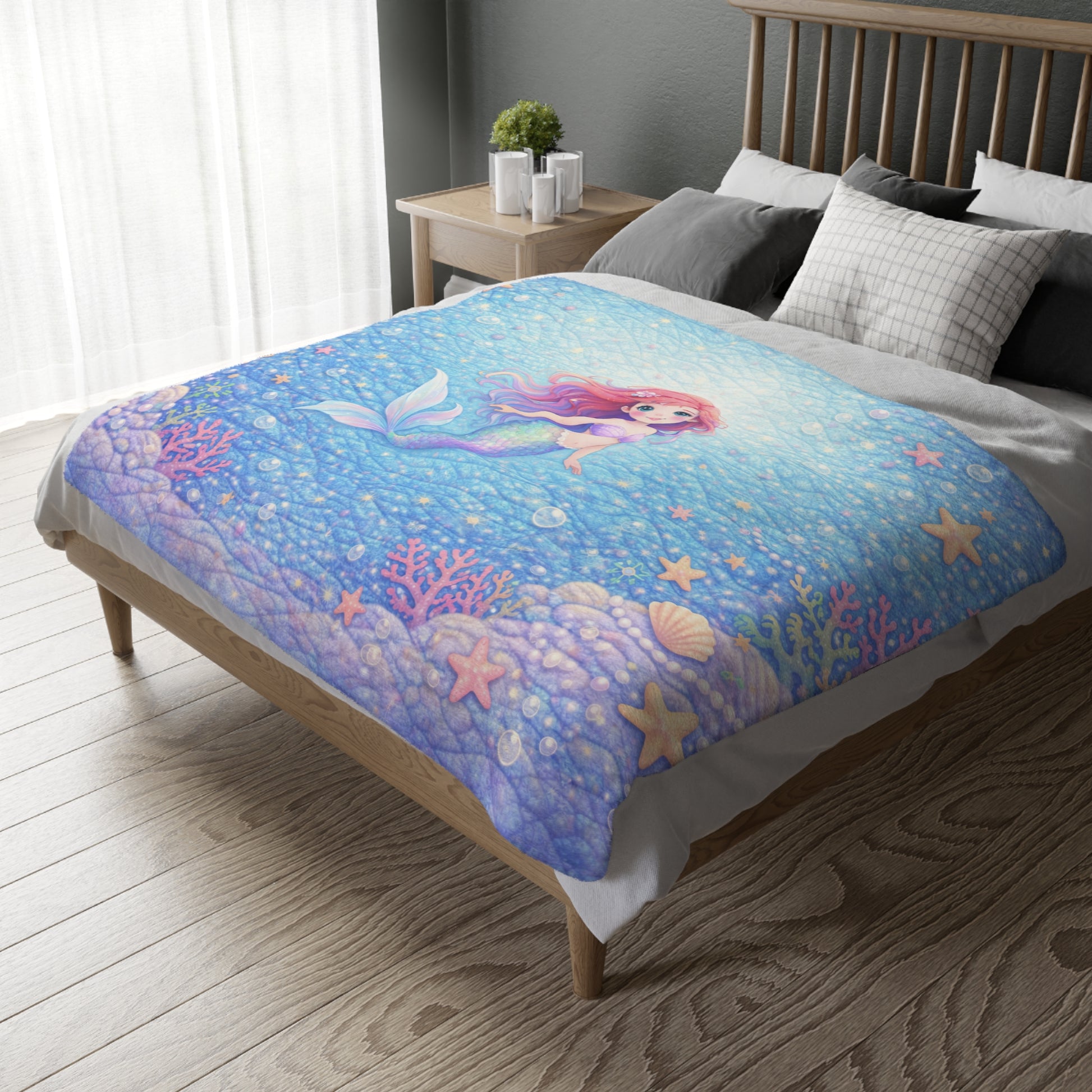 Bed with a mermaid-themed comforter in a bedroom setting