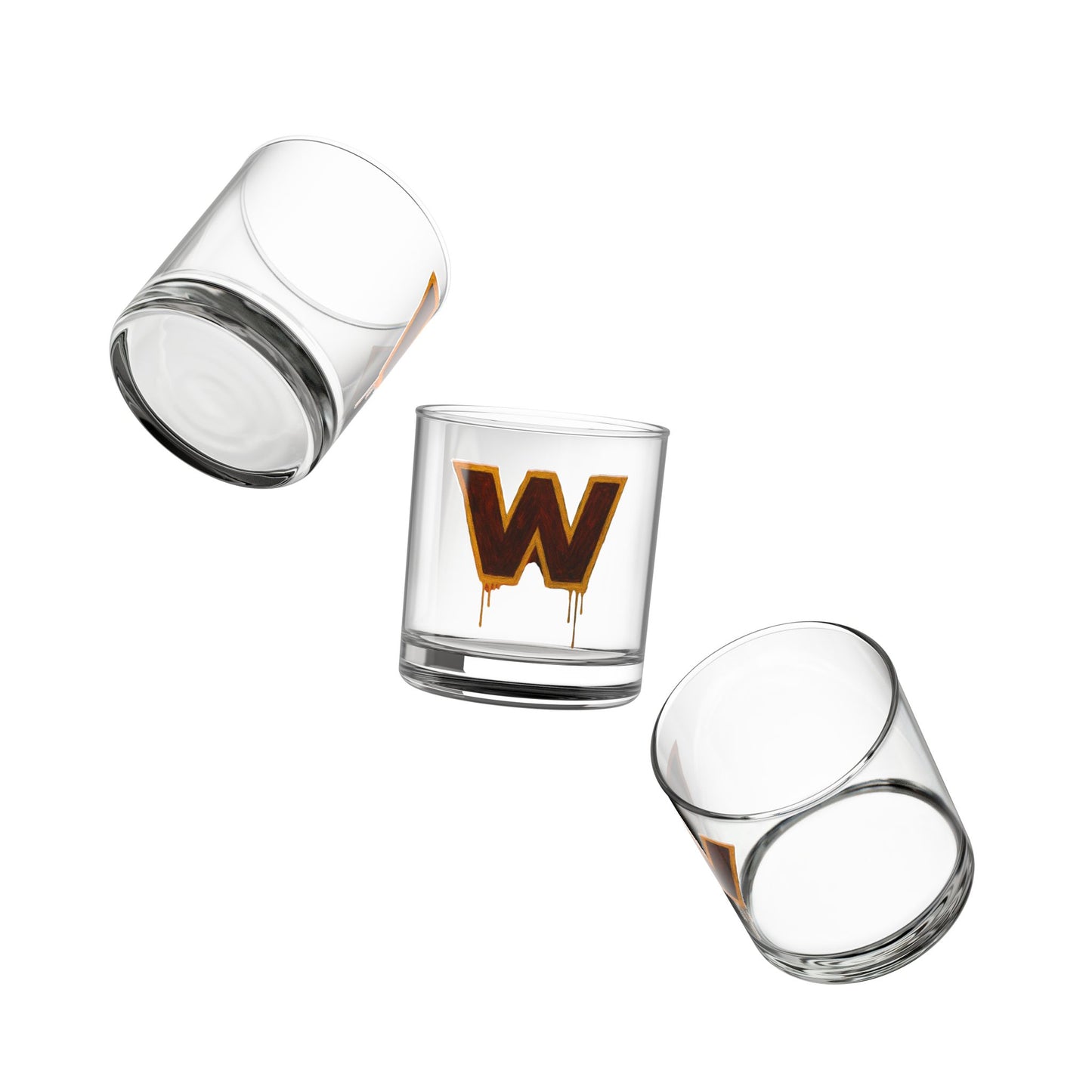 Three clear glass tumblers with a central glass featuring a brown 'W' design on a white background.
