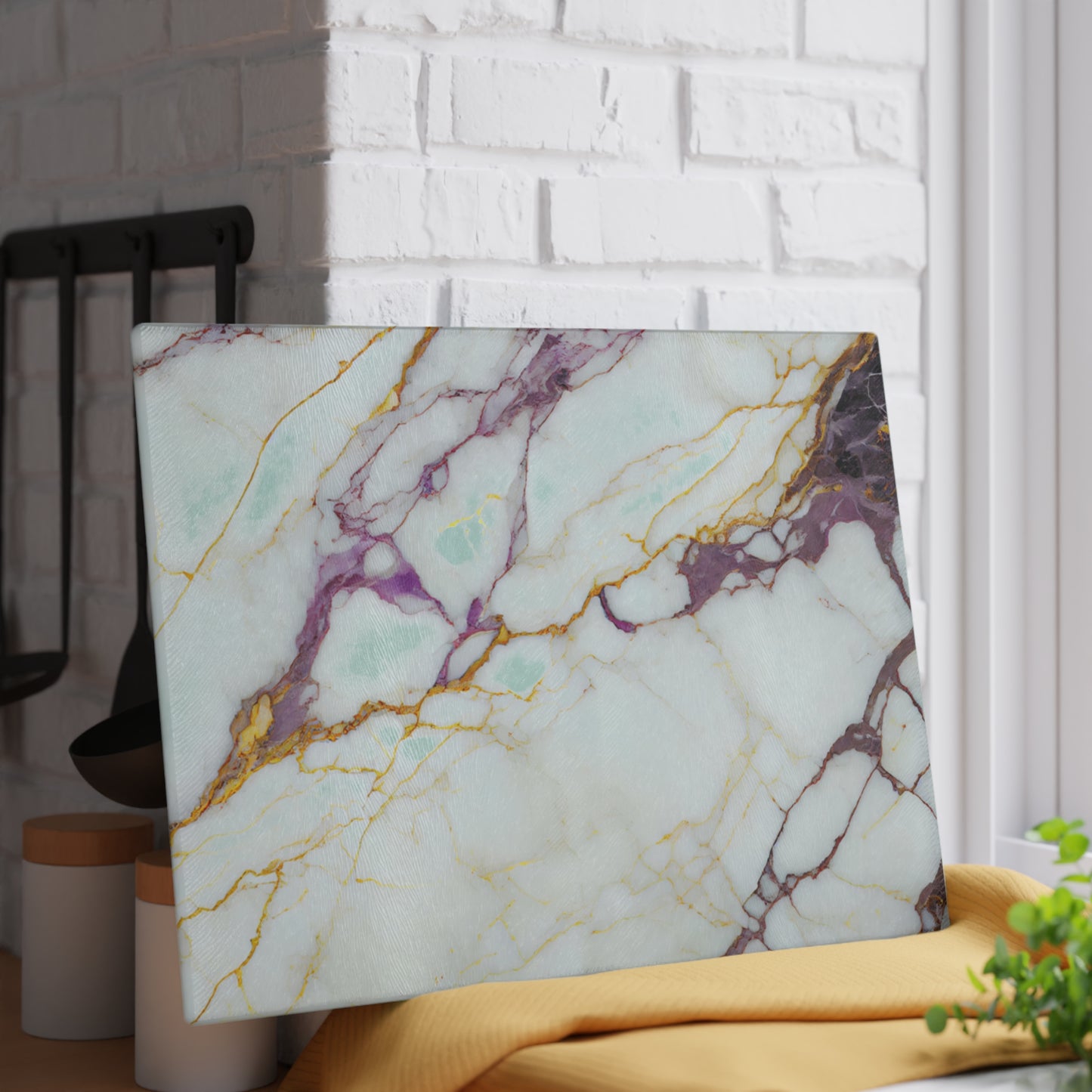 Marble-patterned laptop on a white brick wall background