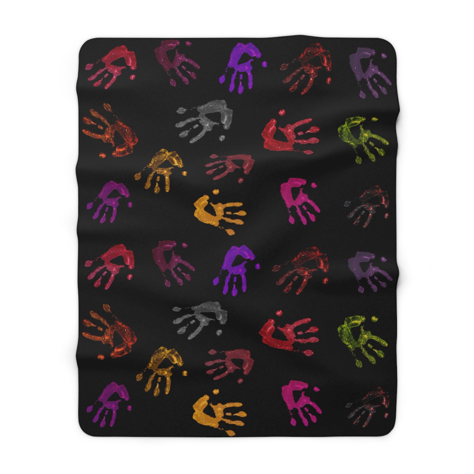 Black blanket with colorful handprints on a white background