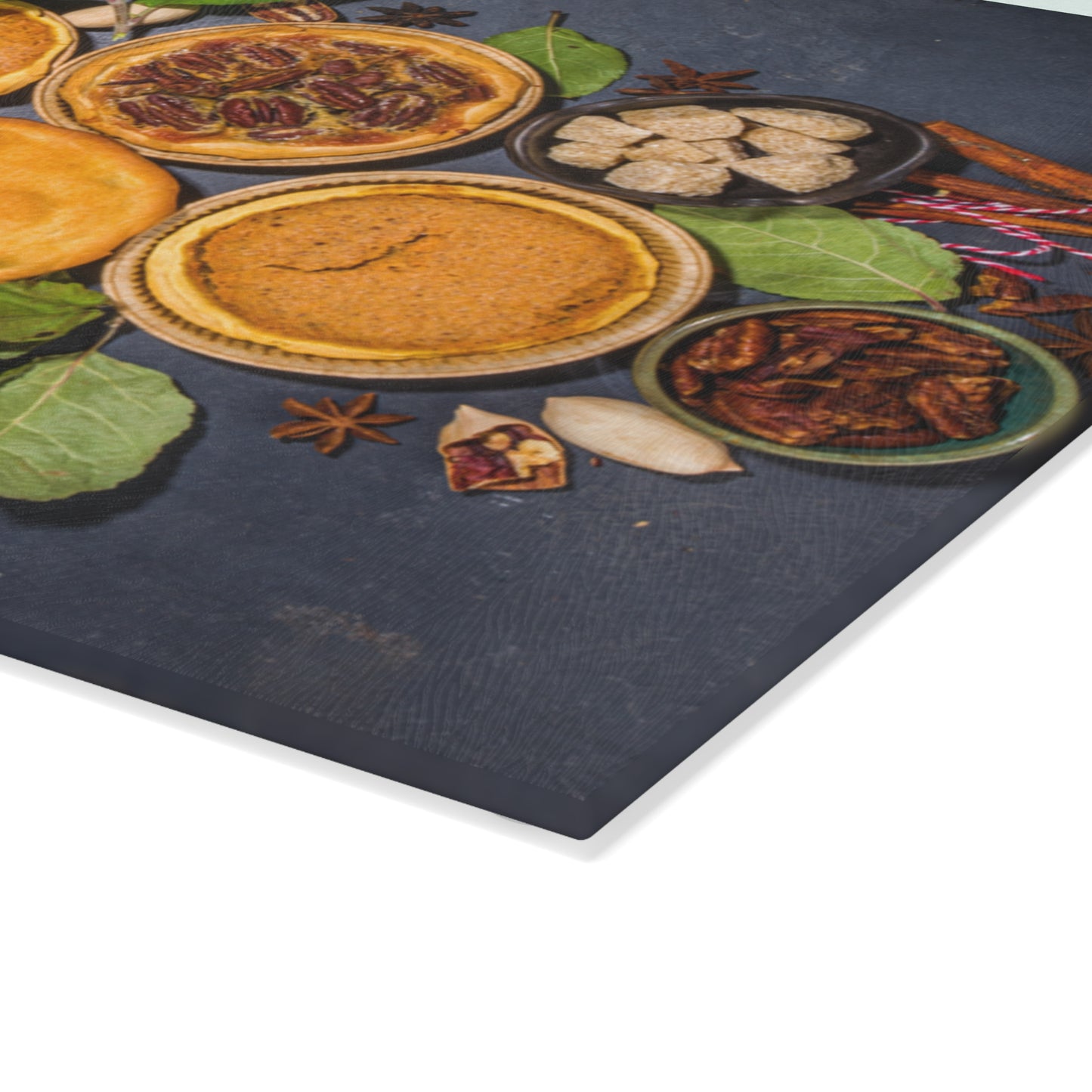 Decorative mat with pie illustrations and spices on a dark surface