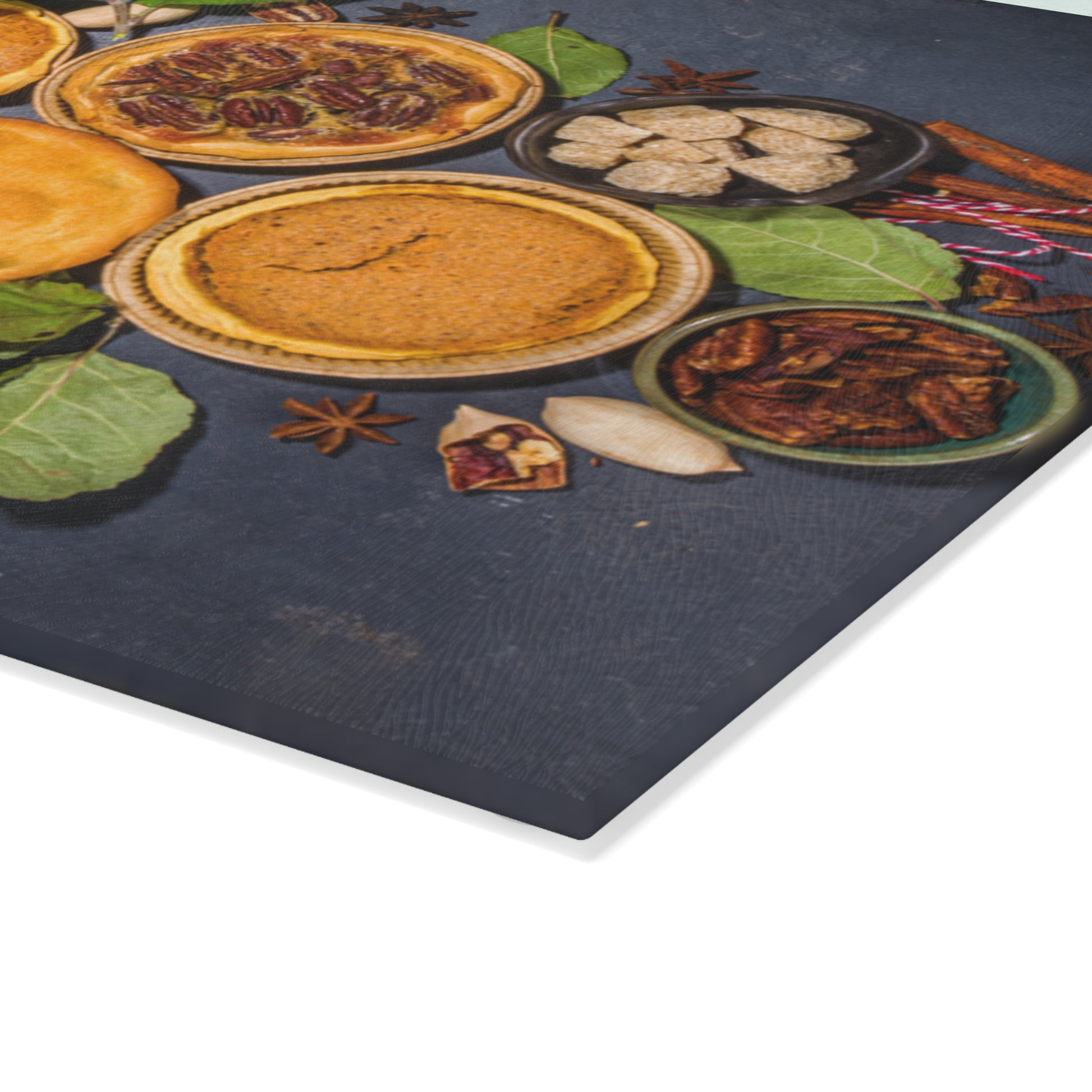 Decorative mat with pie illustrations and spices on a dark surface