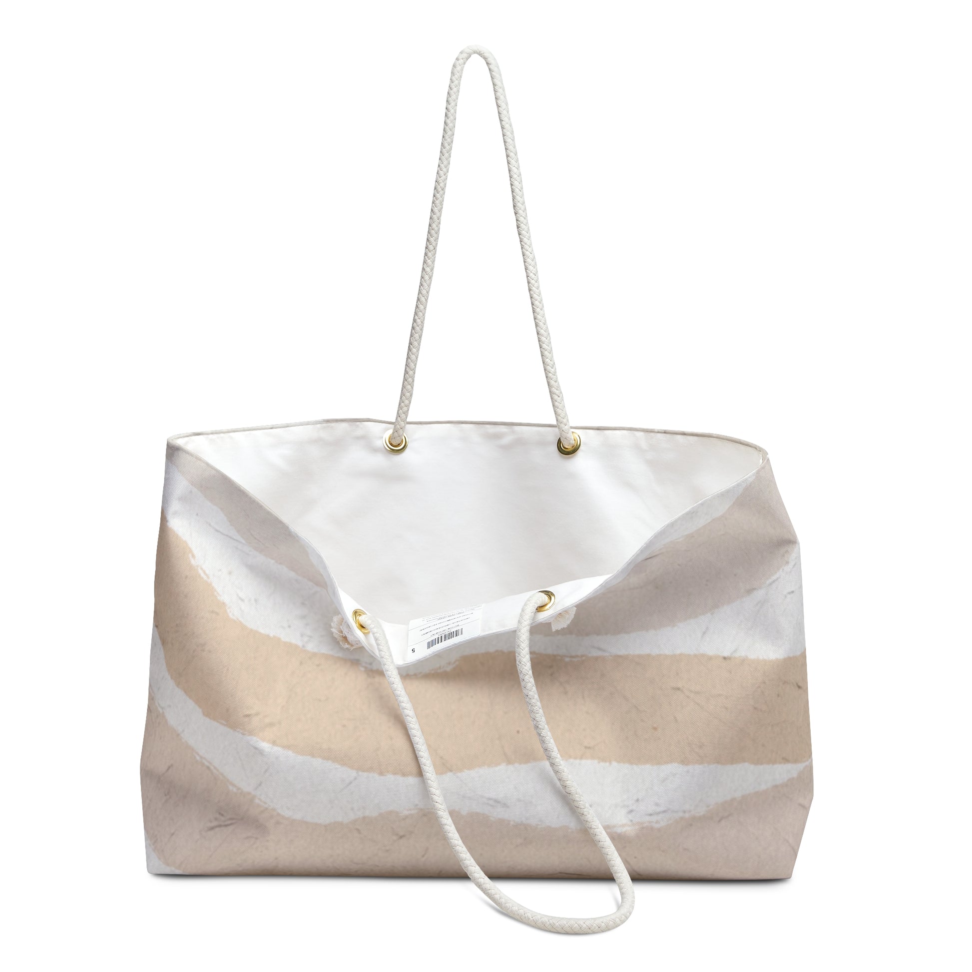 Beige and white striped tote bag with a rope handle on a white background