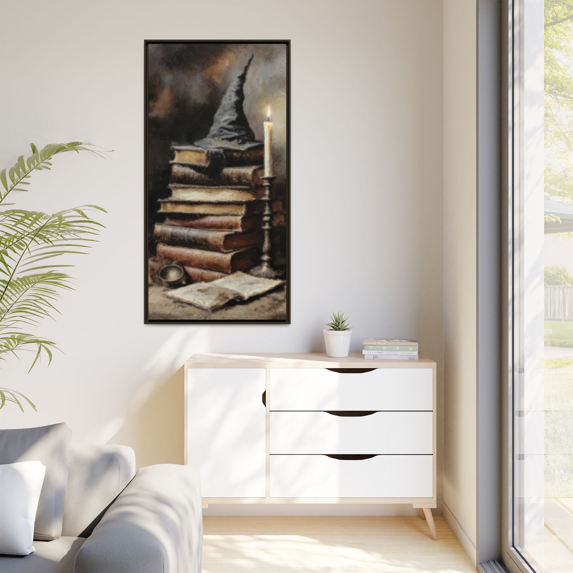 Modern living room with a white cabinet, plant, and framed artwork on the wall.