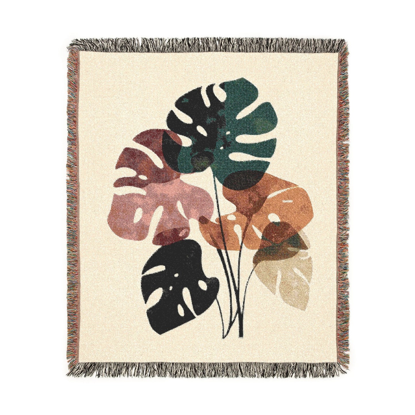Decorative throw blanket with leaf pattern on a beige background
