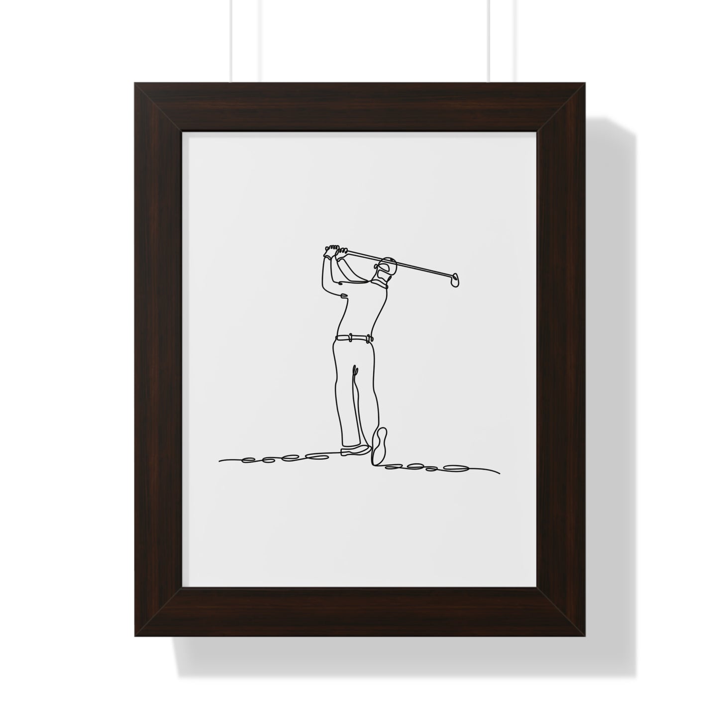 Framed artwork of a golfer in a brown frame on a white background