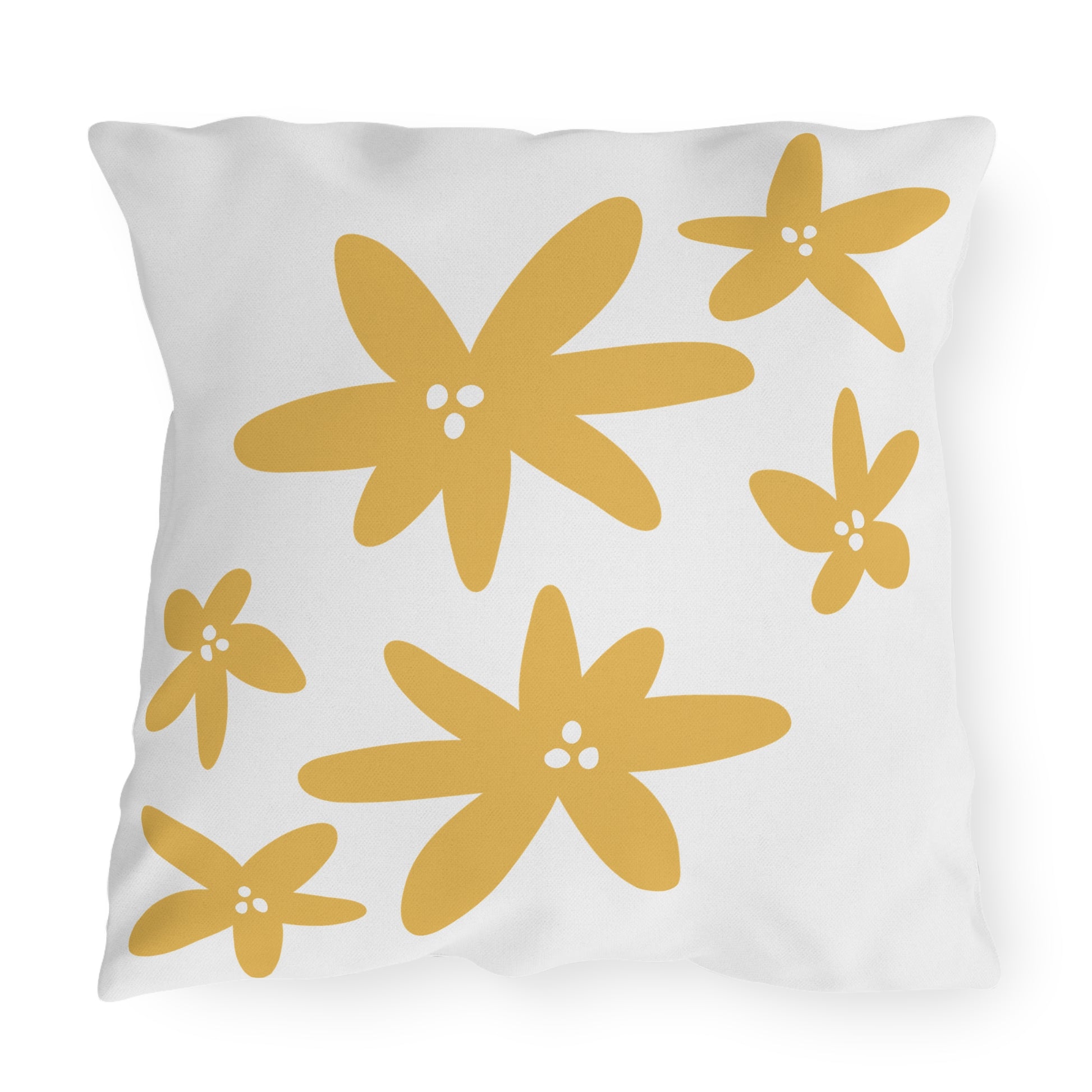 White pillow with yellow flower patterns on a white background
