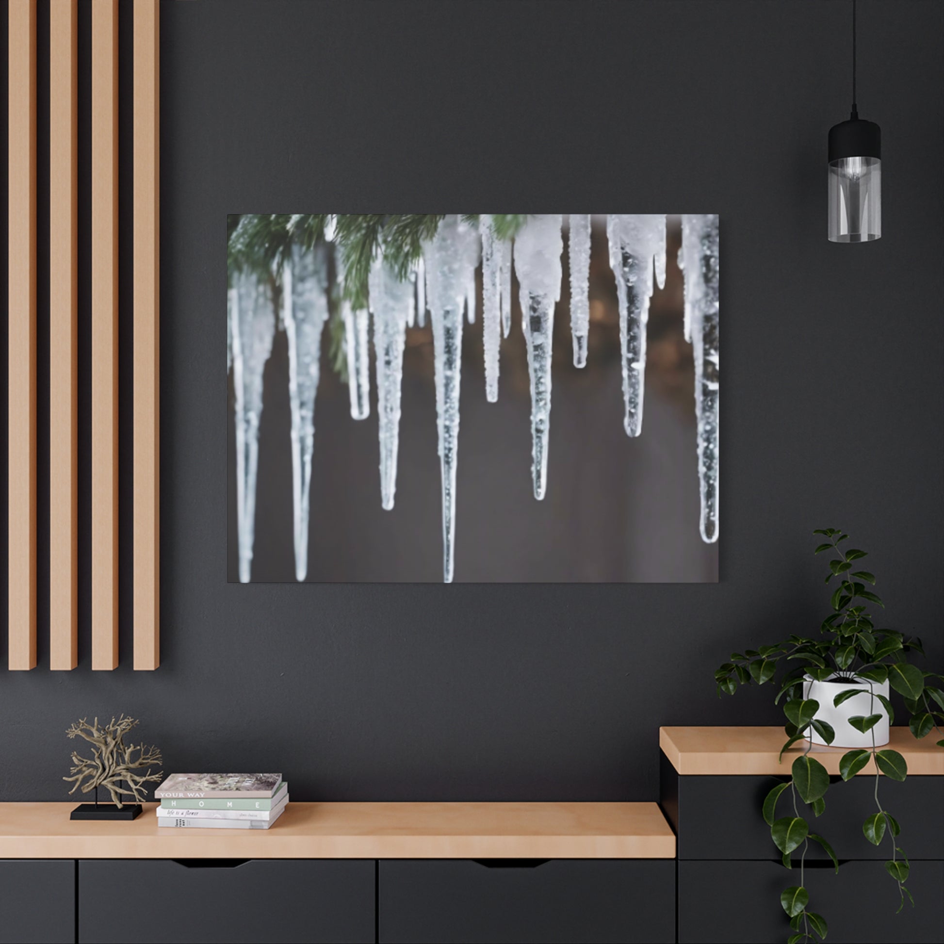 Modern interior with a dark wall, wooden shelf, and framed photo of icicles.