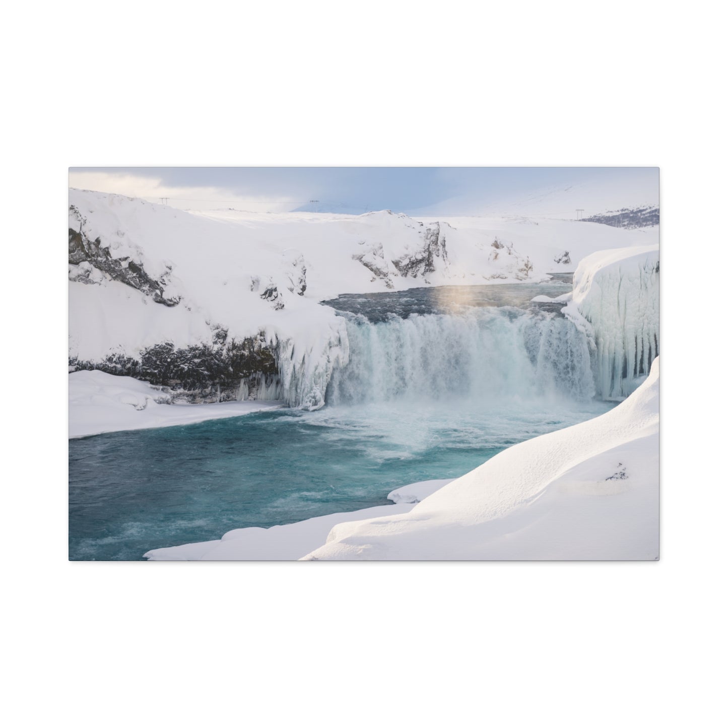 Frozen waterfall in a snowy landscape