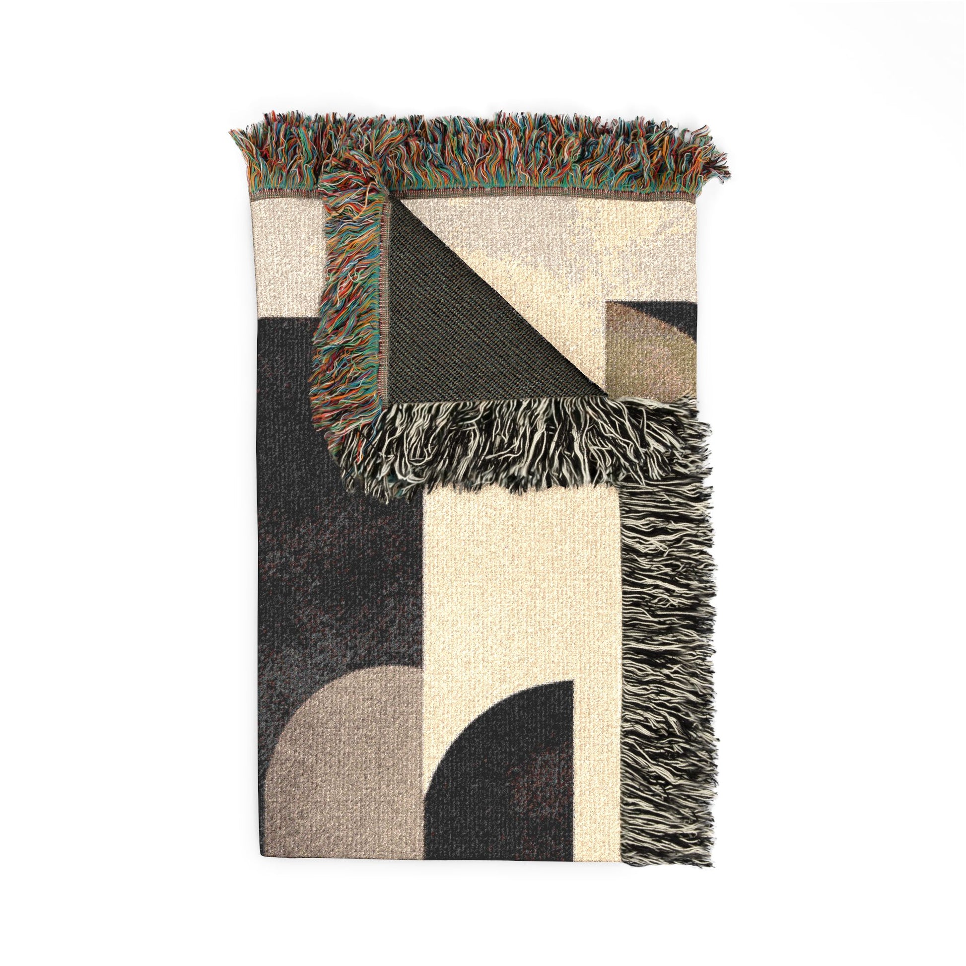 Geometric patterned rug with fringes on a white background