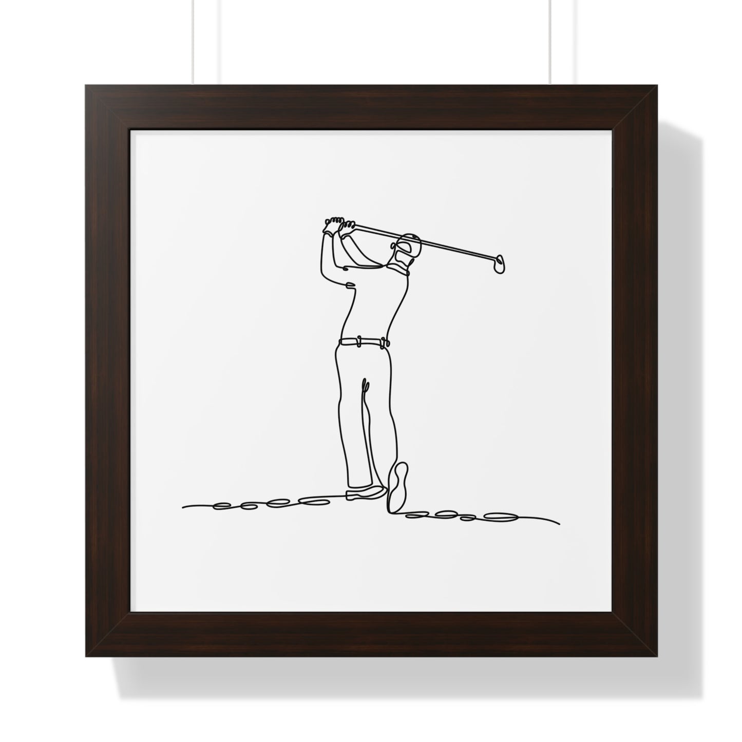 Framed artwork of a golfer in a brown frame on a white background