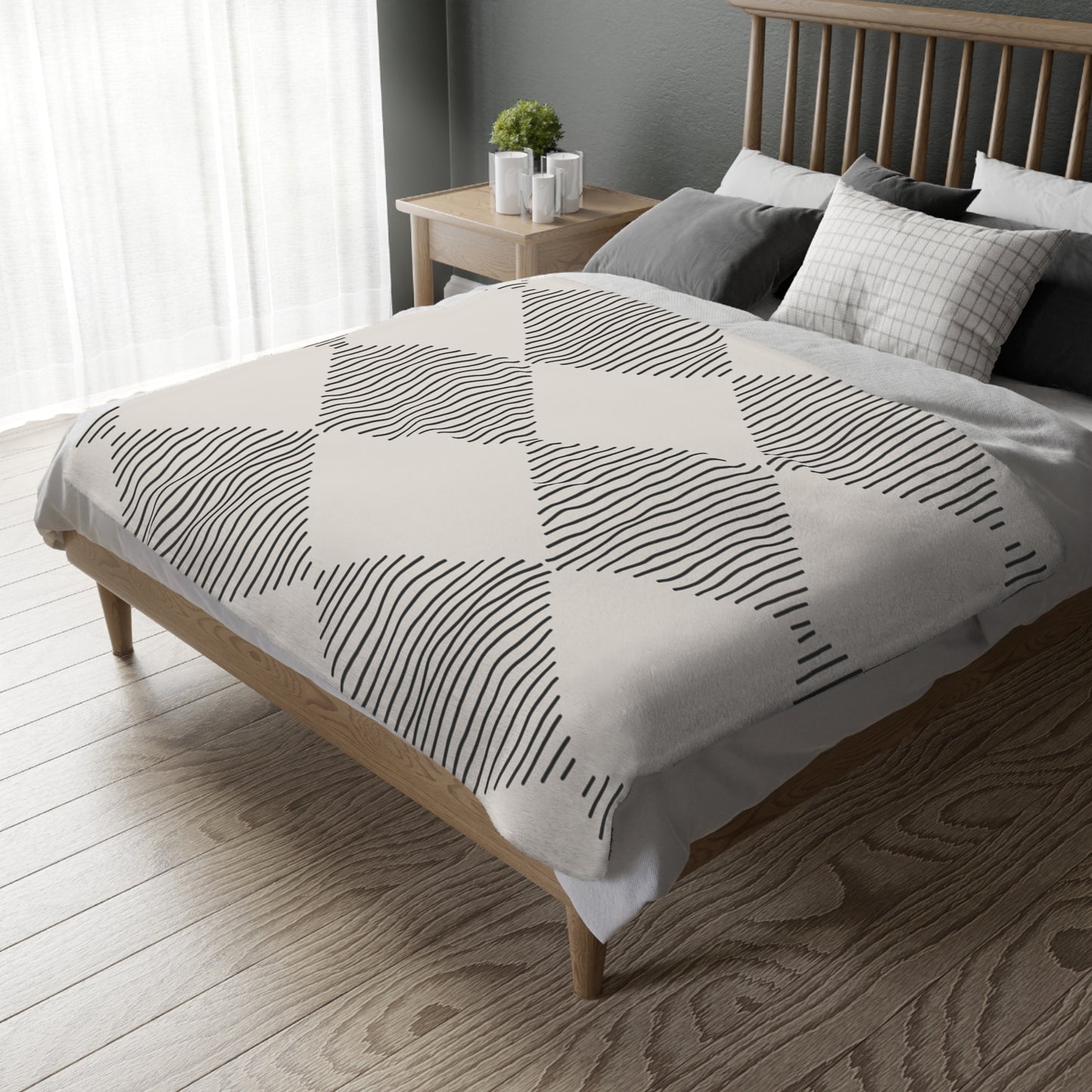 Bed with geometric patterned duvet cover in a bedroom setting