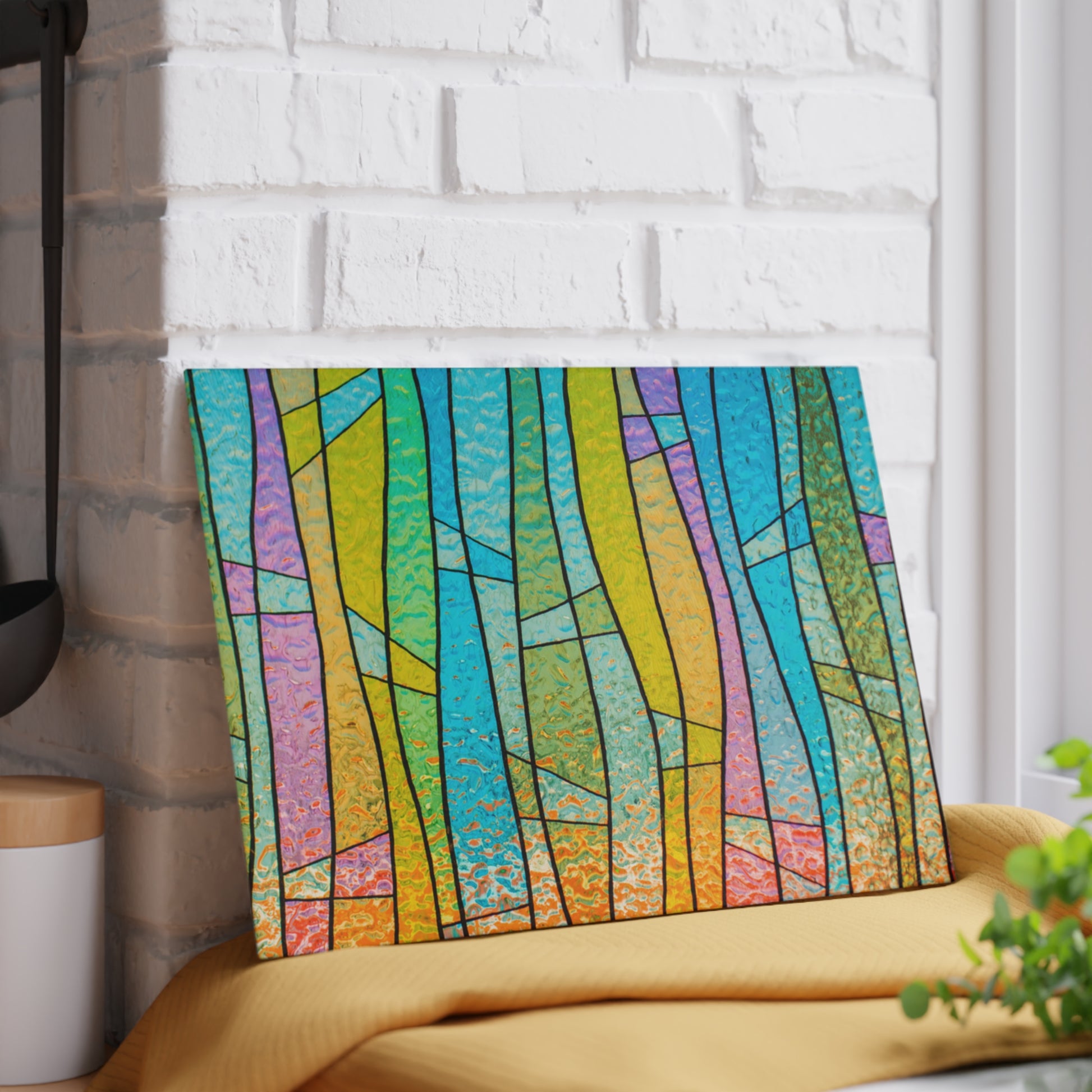 Colorful abstract art piece on a white brick wall
