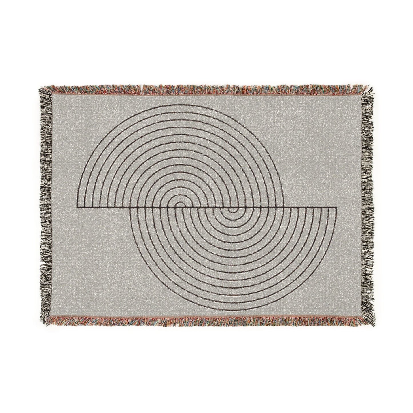 Woven blanket with geometric circular pattern on a plain background
