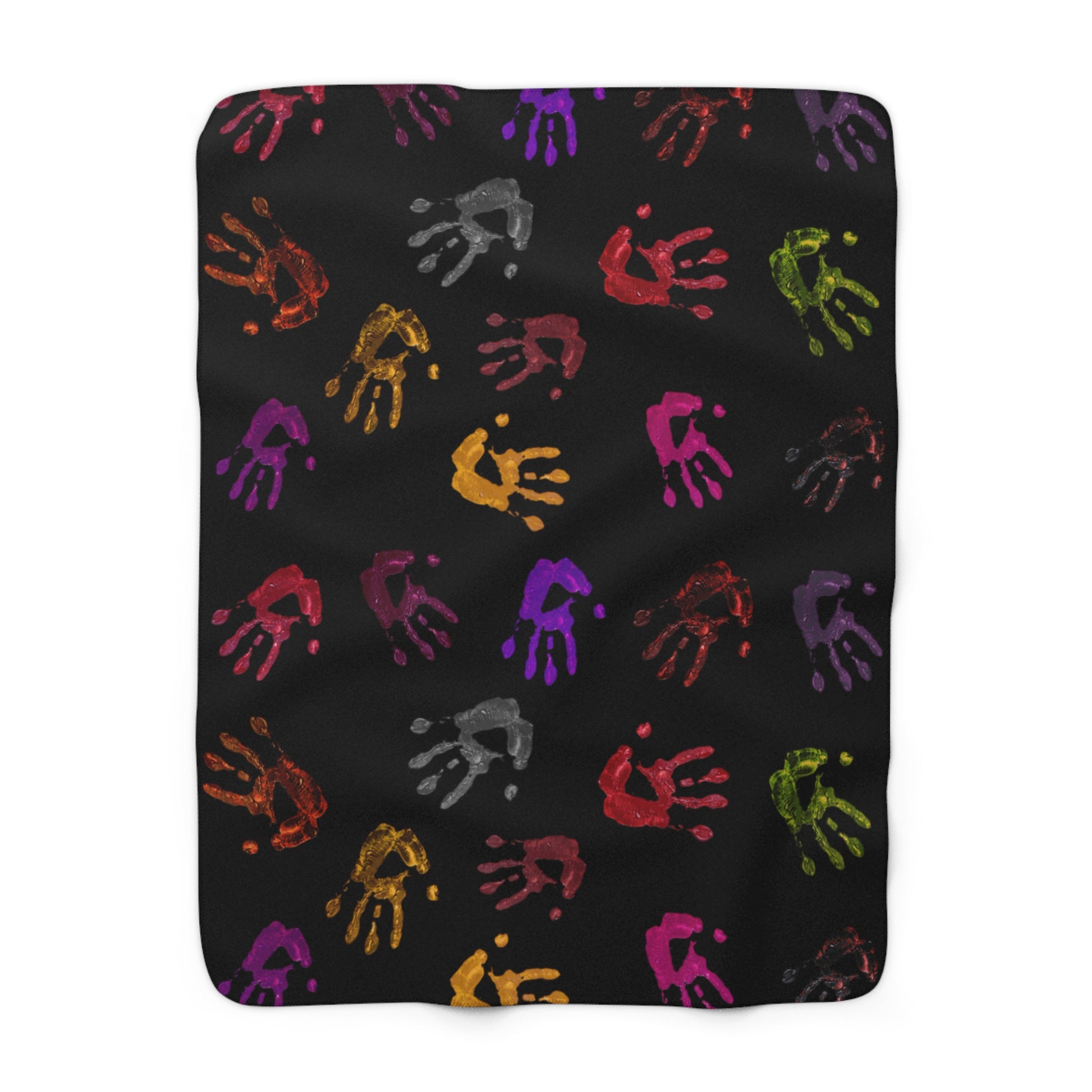 Black blanket with colorful handprints on a white background