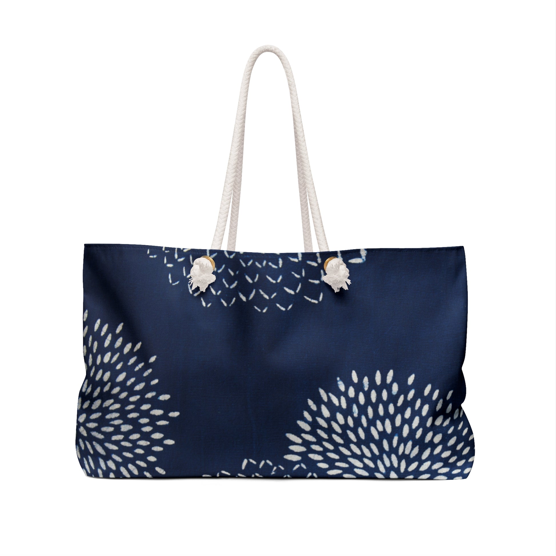 Navy blue tote bag with white floral patterns on a white background