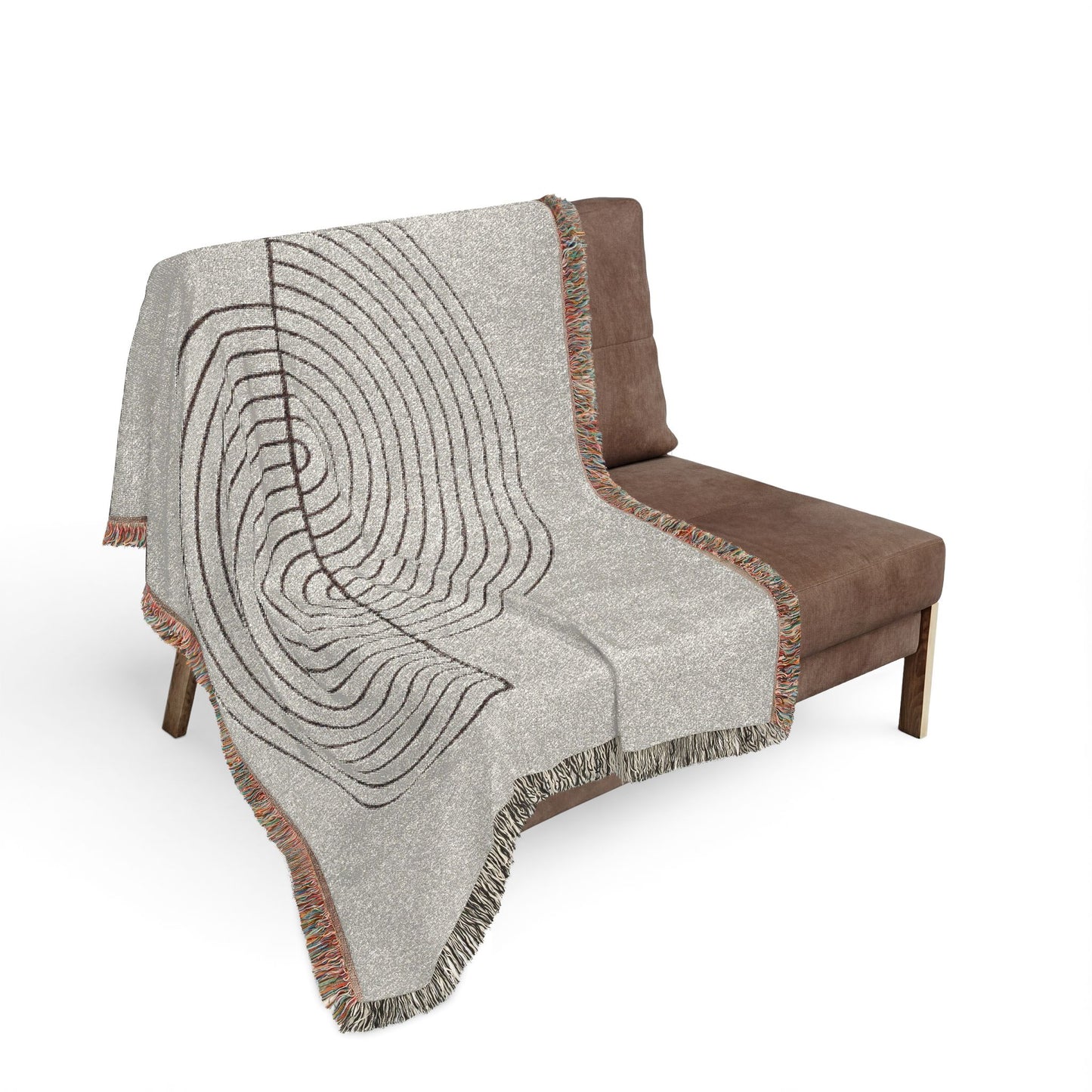 Gray patterned throw blanket draped over a brown chair on a white background