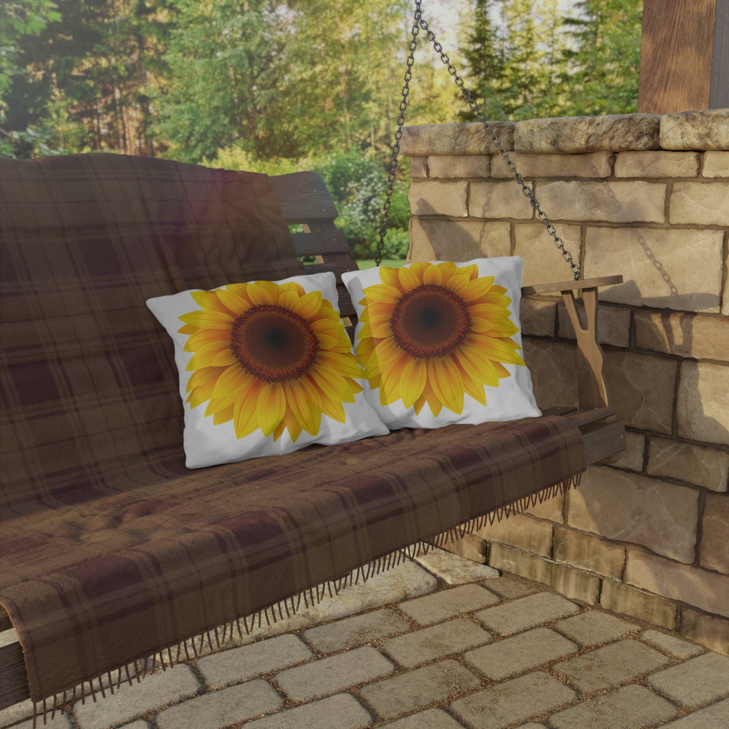Wooden swing with sunflower-patterned cushions in a garden setting