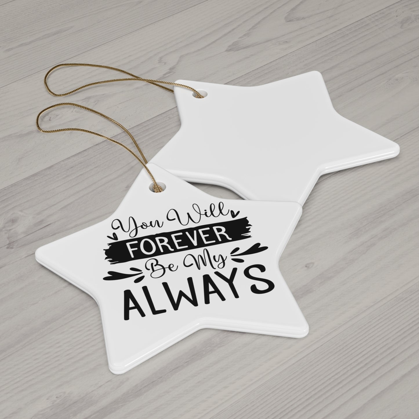 Star-shaped white ornament with 'You Will Forever Be My Always' text on a wooden surface