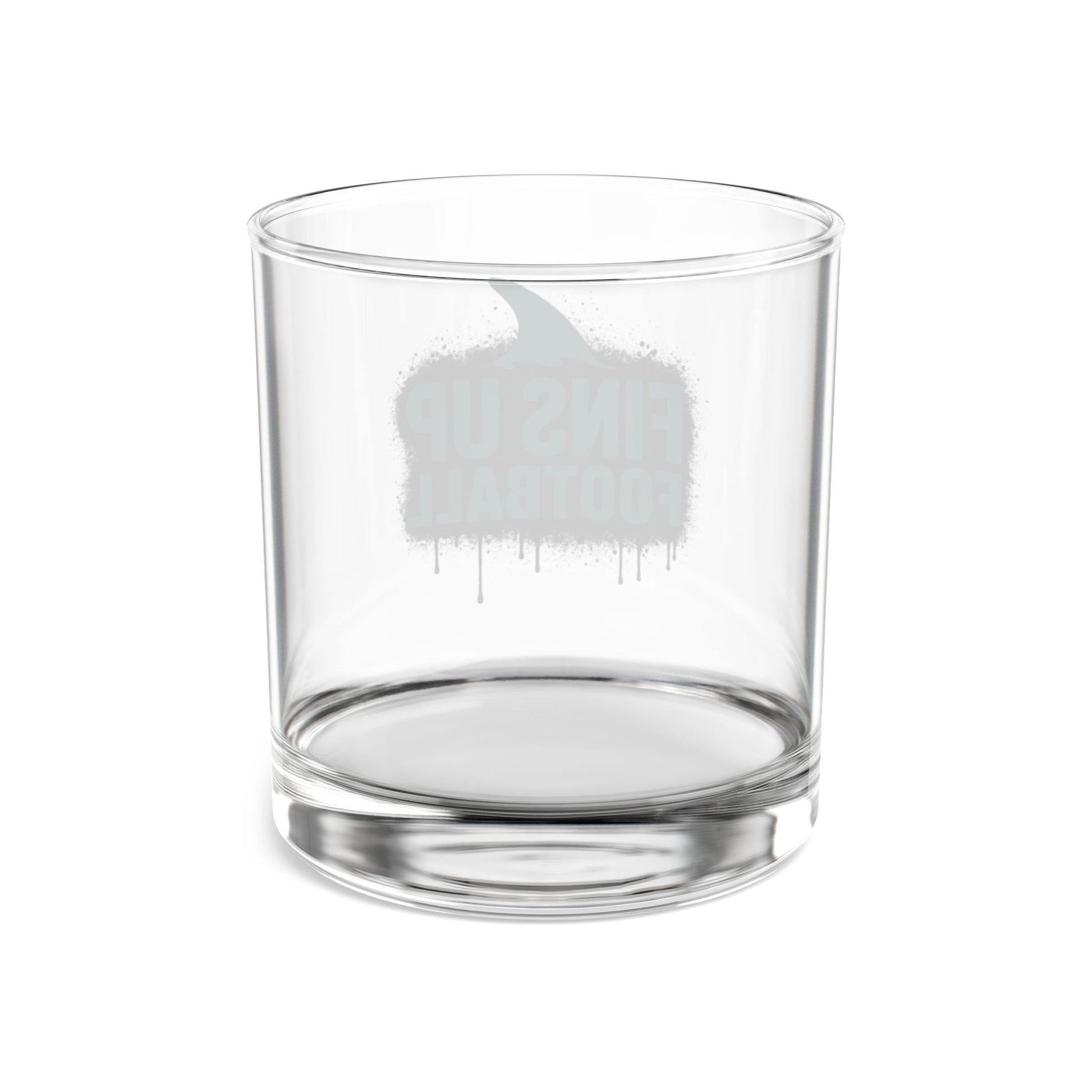 Clear glass tumbler with a white elephant design on a white background