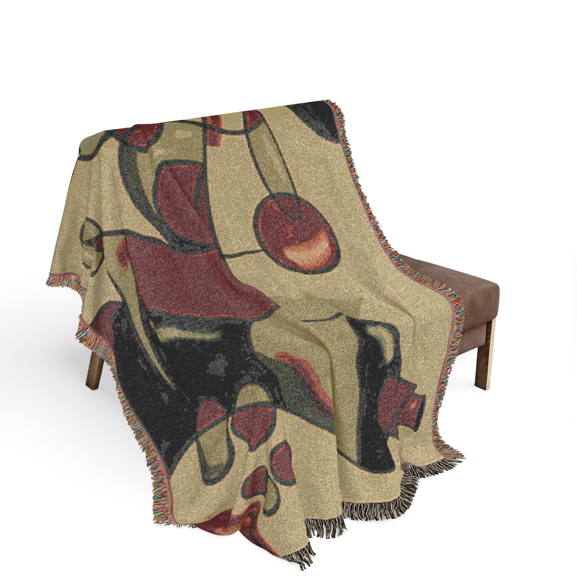 Decorative blanket with abstract pattern draped over a chair on a white background