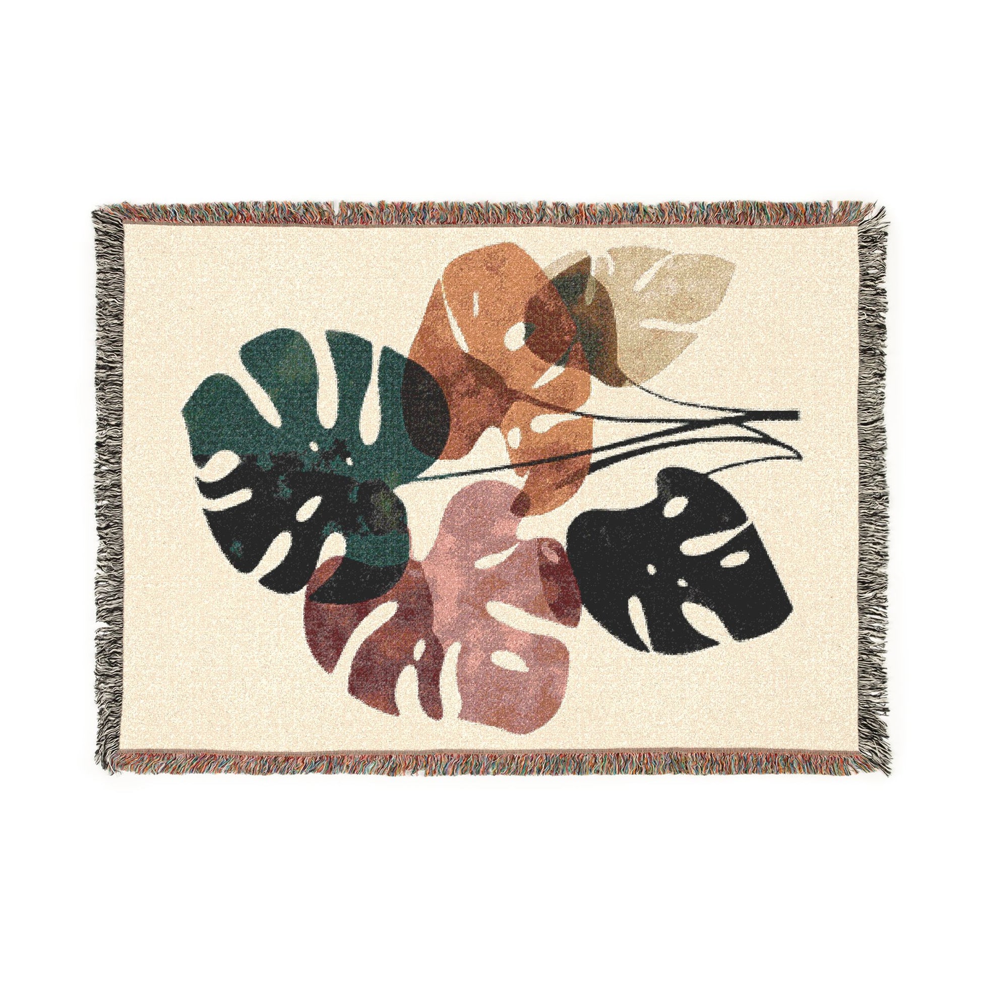 Woven blanket with leaf pattern on a white background