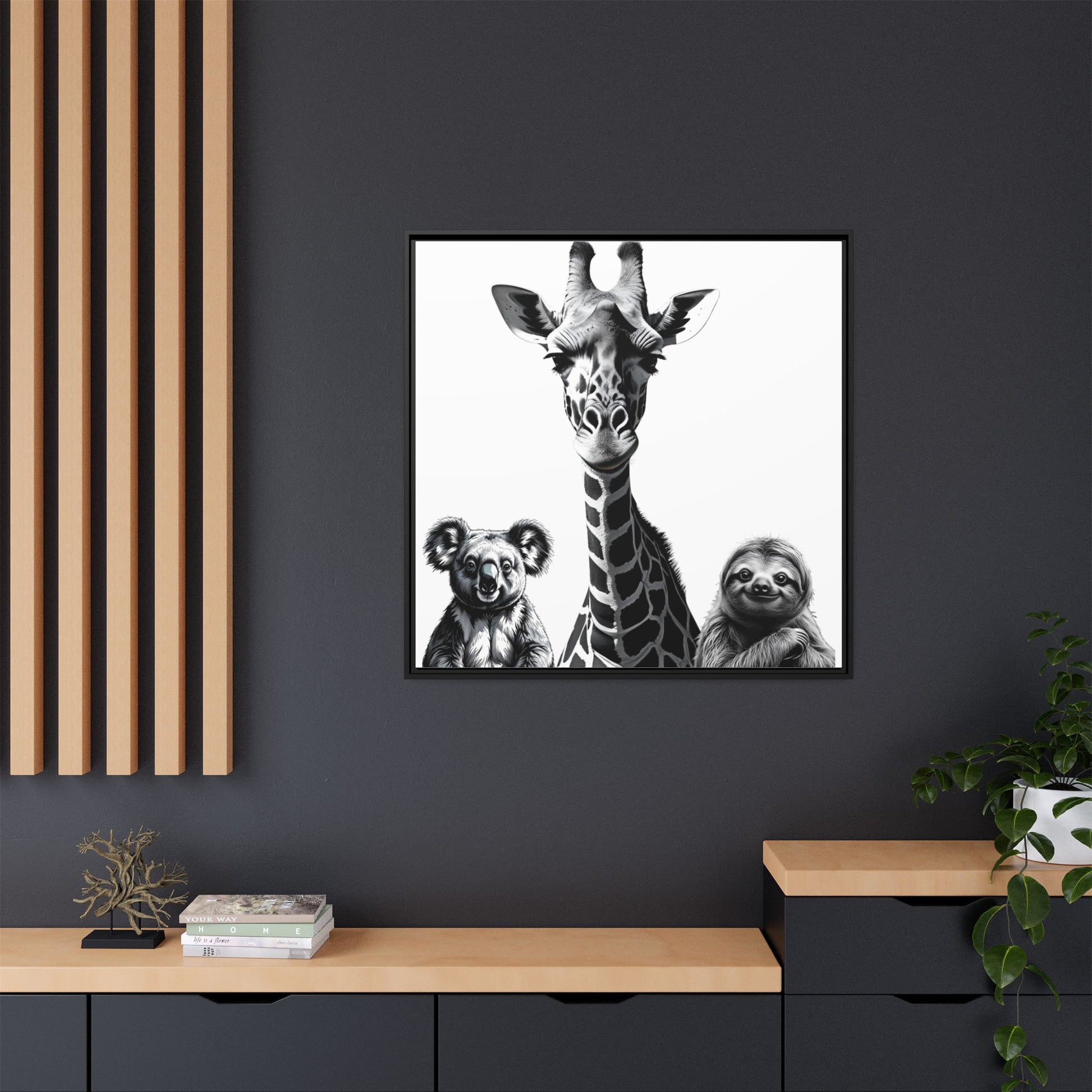 Framed artwork of a giraffe, koala, and sloth on a dark wall with wooden shelves.