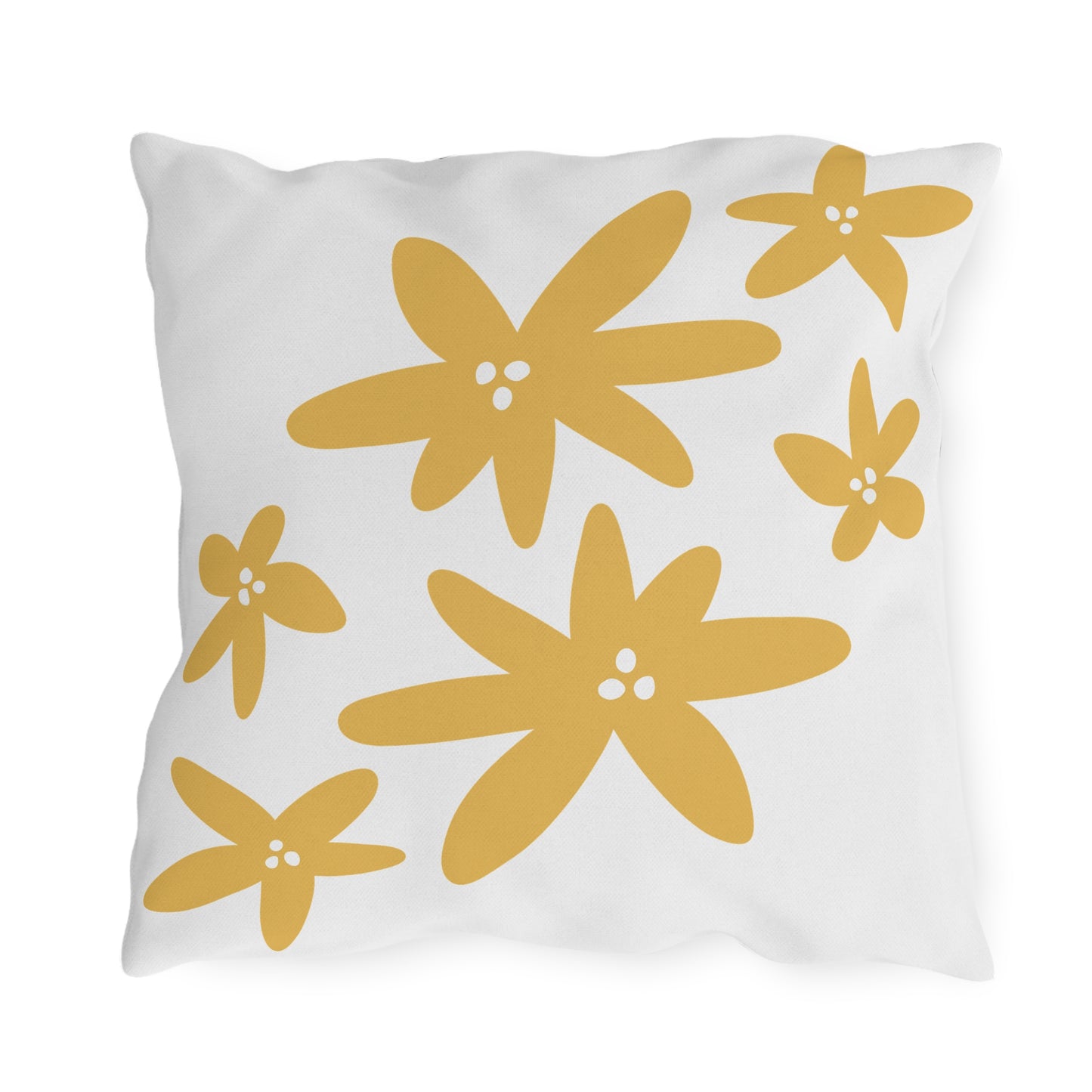 White pillow with yellow floral patterns on a white background
