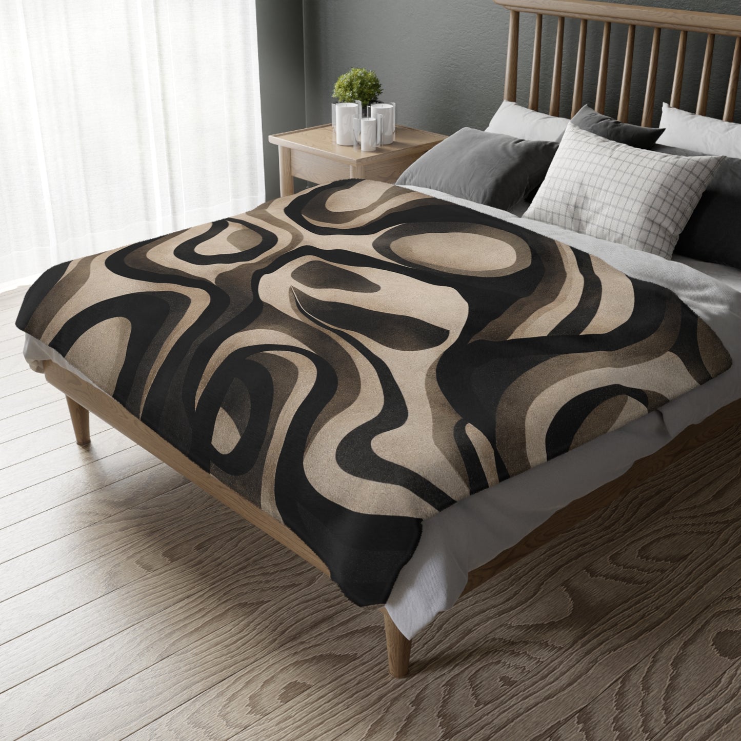 Bed with a patterned comforter in a bedroom setting