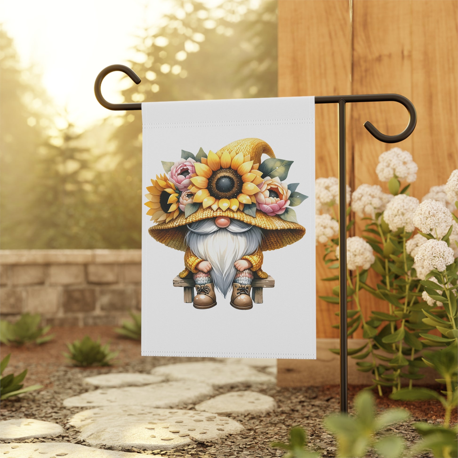 Gnome garden flag with sunflower hat and flowers on a stand outdoors.