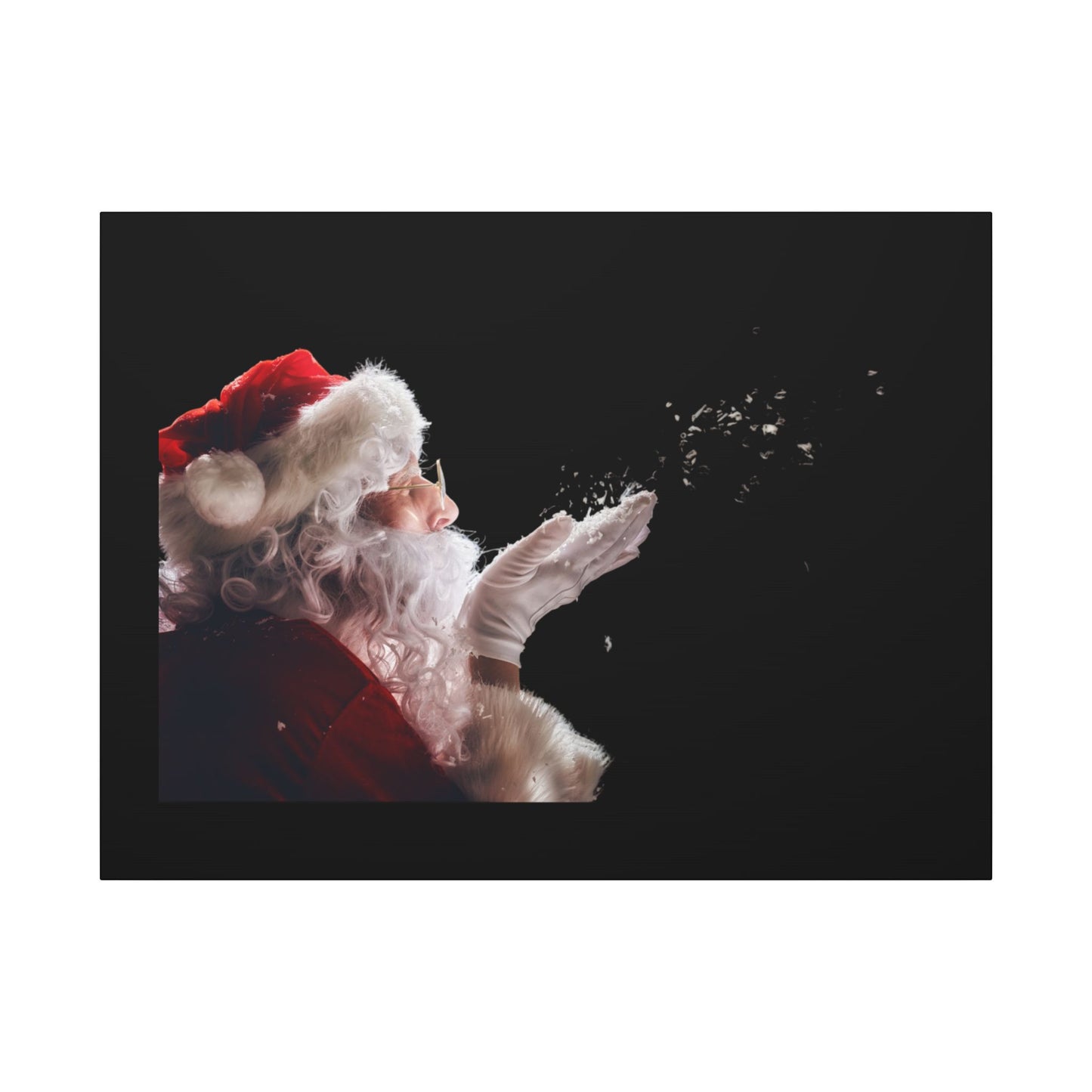 Santa Claus blowing snowflakes against a black background