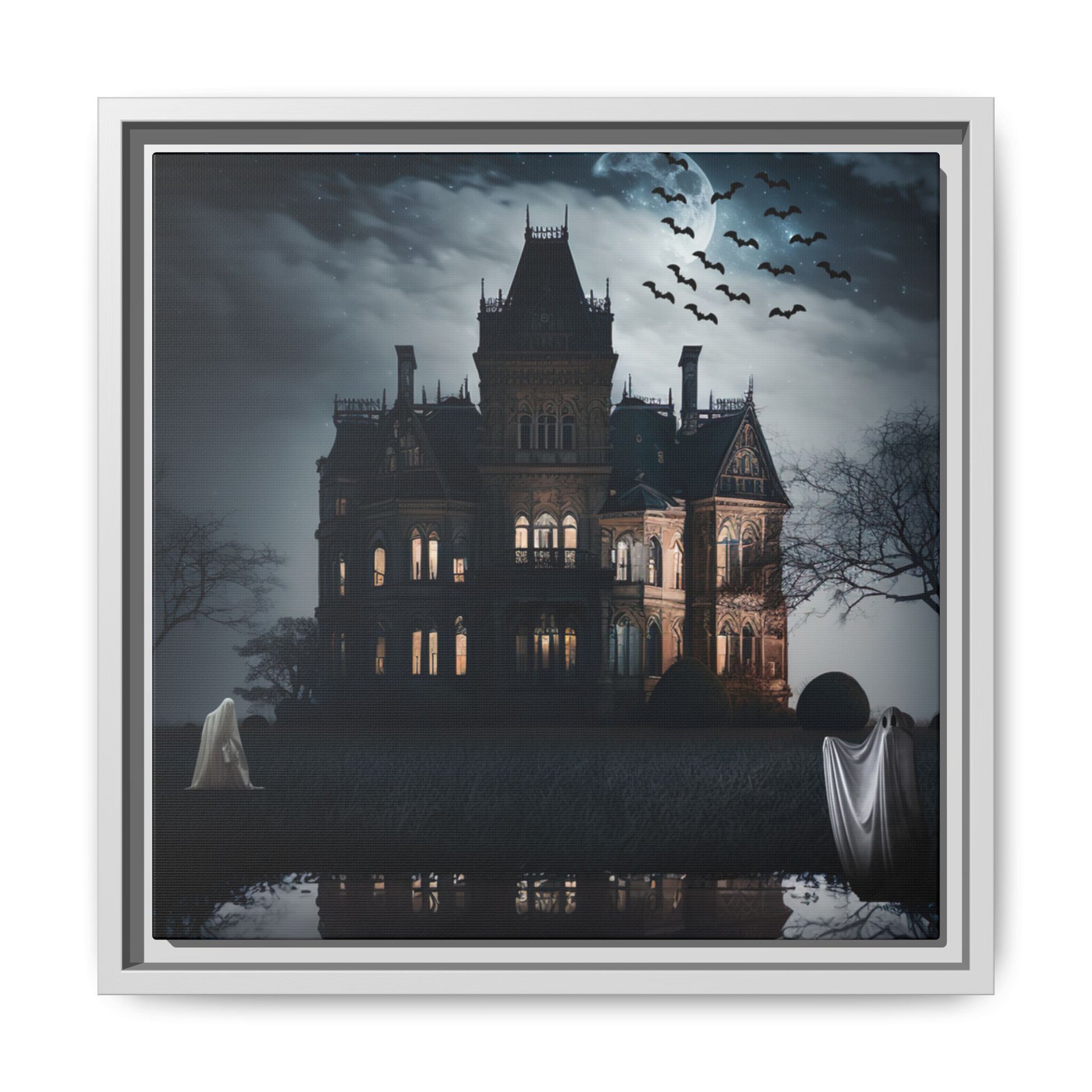 Framed artwork of a haunted house with ghosts and bats at night.