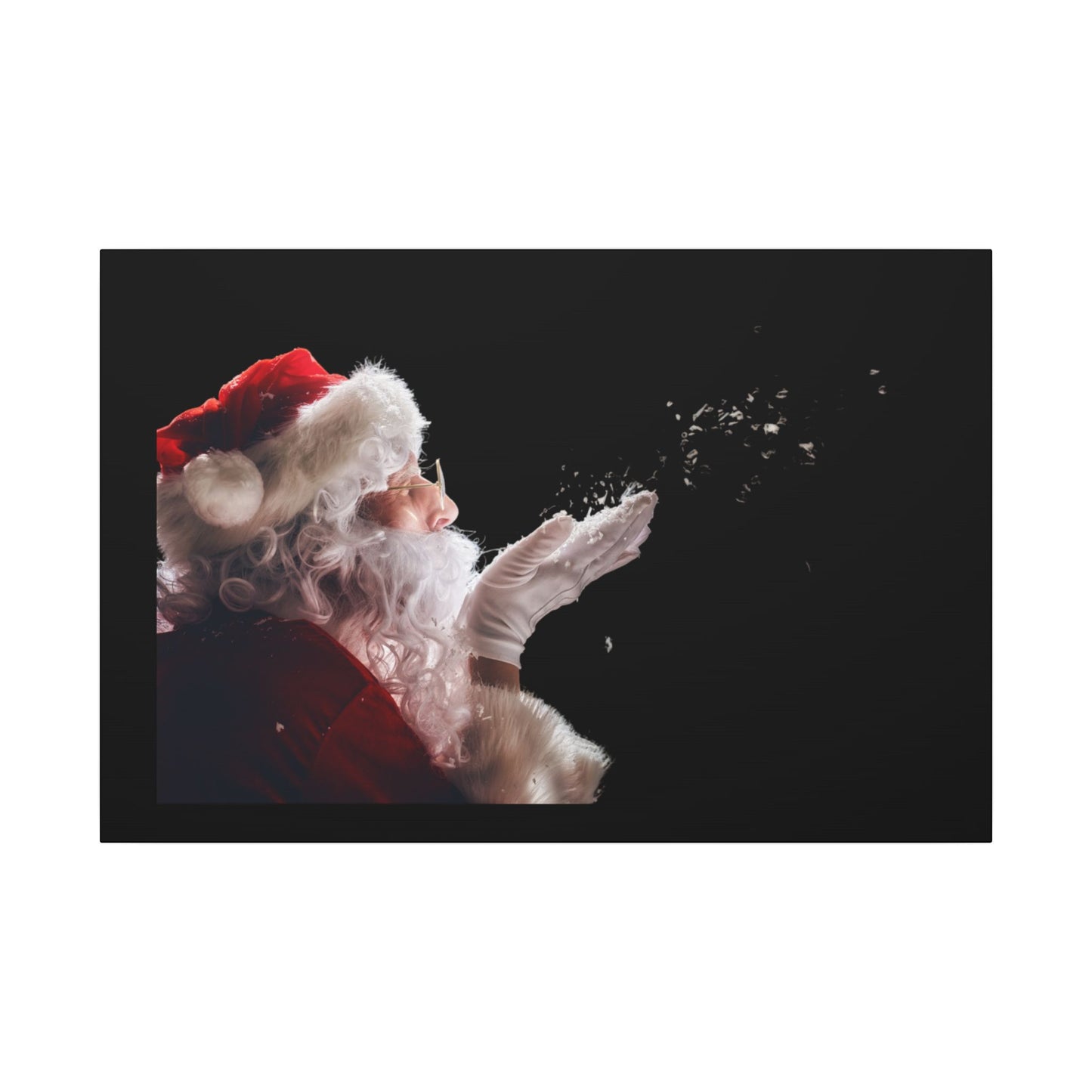 Santa Claus blowing snowflakes against a black background