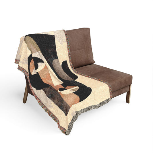 Brown chair with a decorative blanket featuring abstract art on a white background