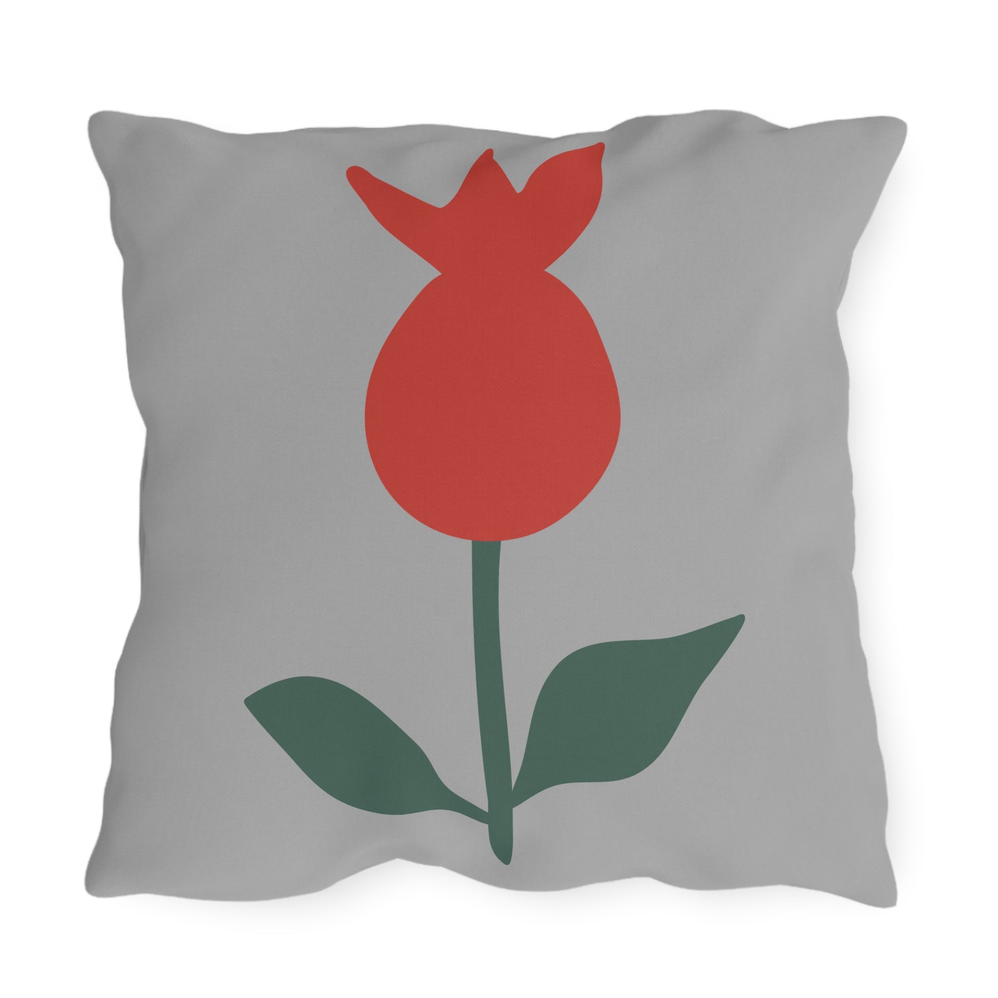 Gray pillow with a red tulip design on a white background
