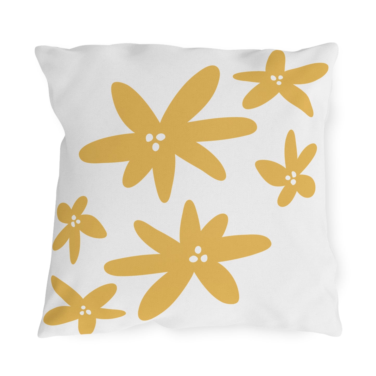 White pillow with yellow floral patterns on a white background
