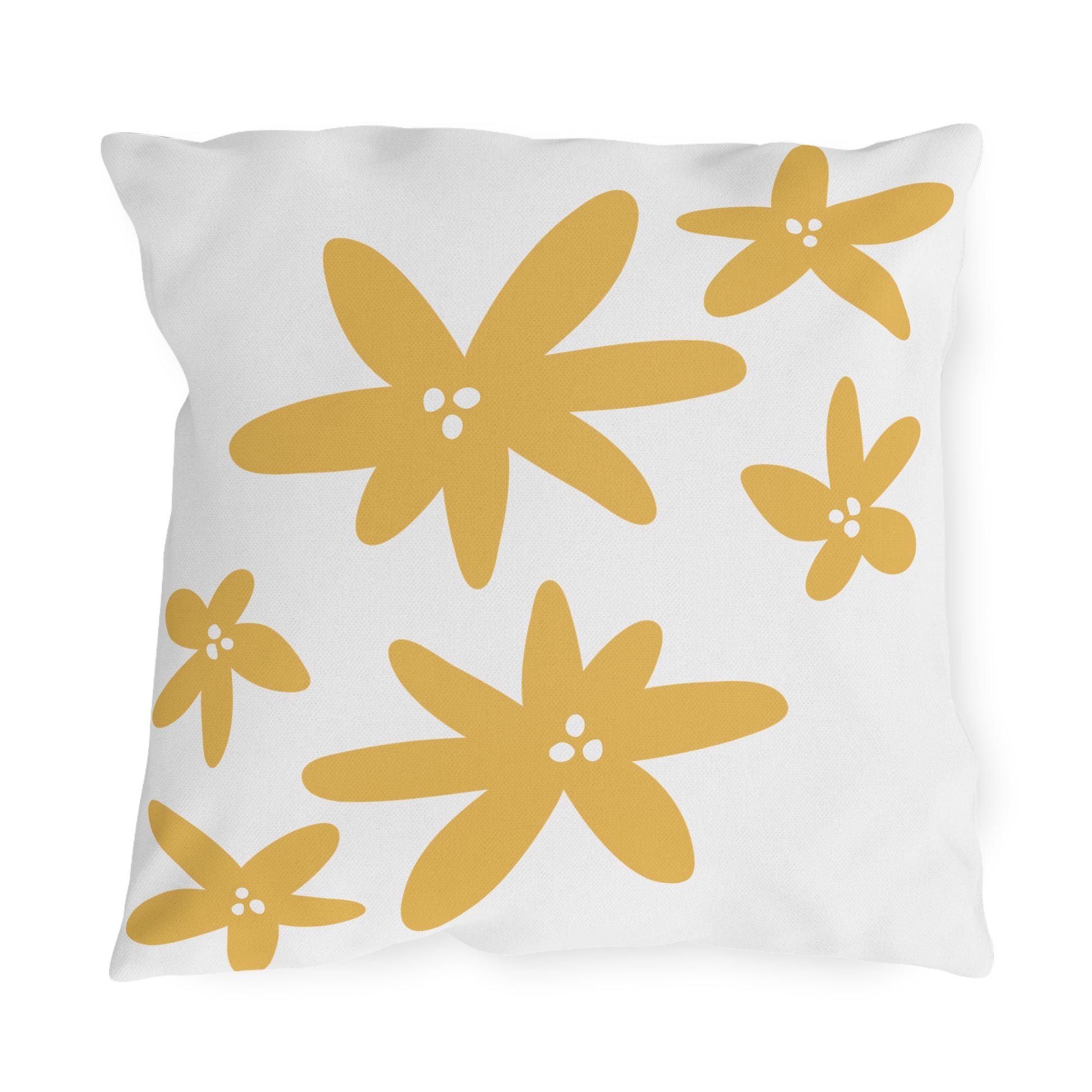 White pillow with yellow floral patterns on a white background