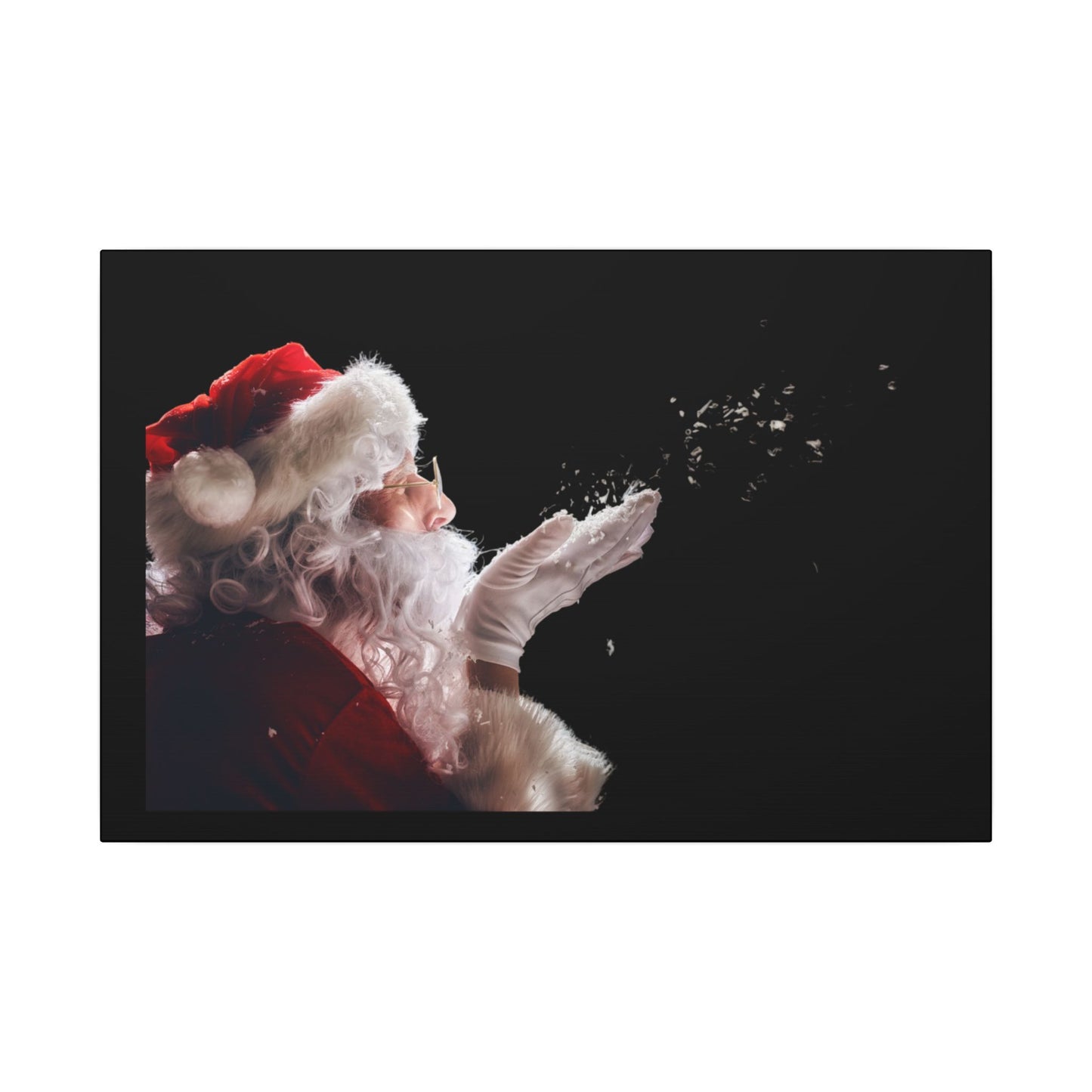 Santa Claus blowing snowflakes against a black background