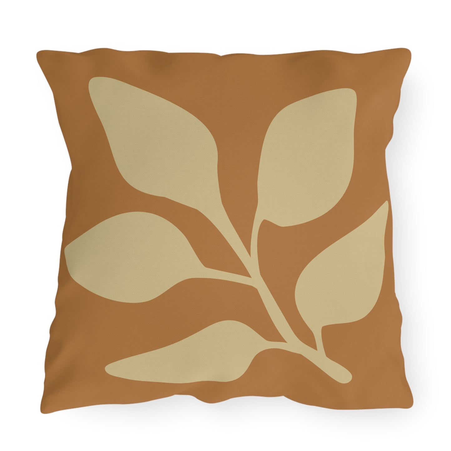 Decorative pillow with leaf pattern on a white background