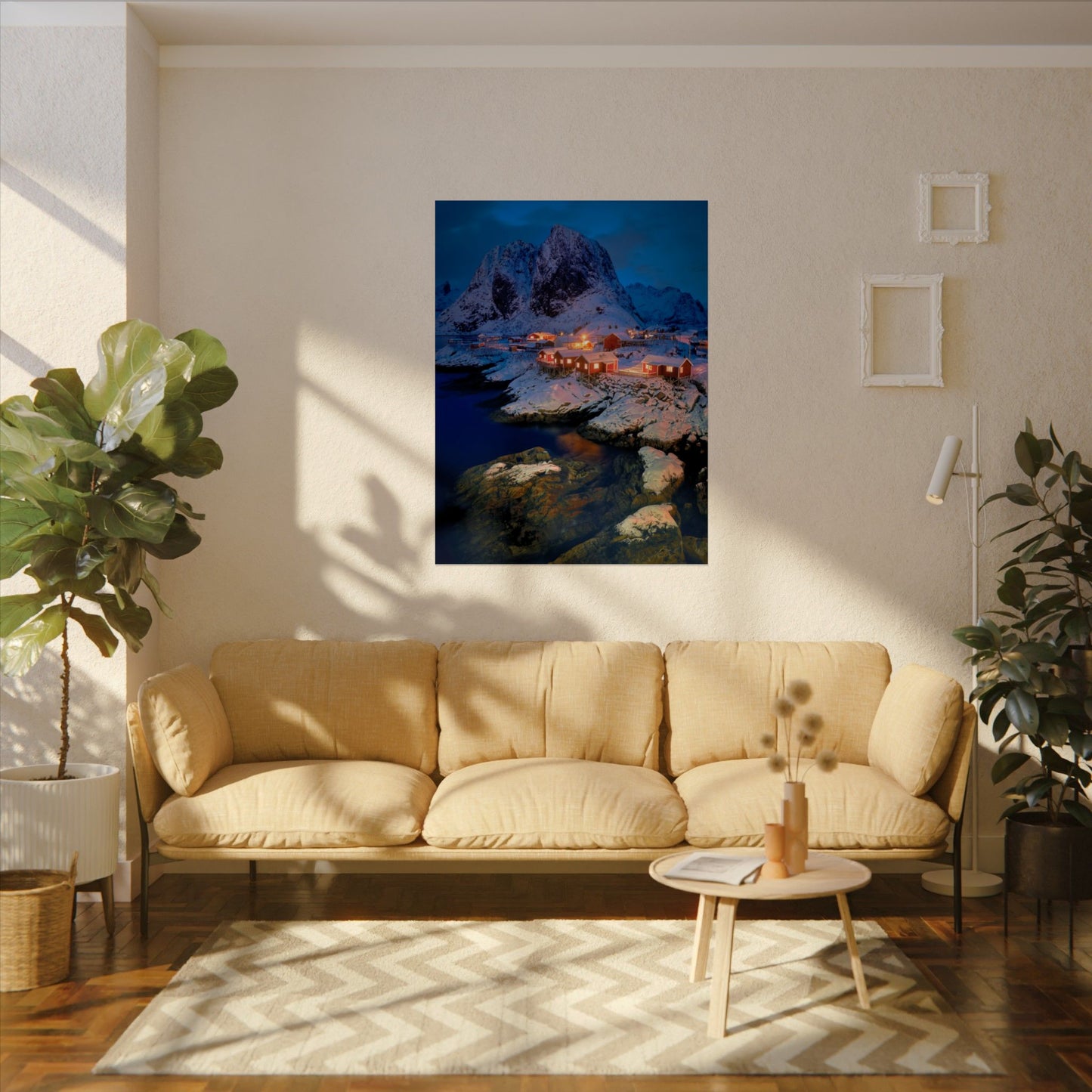 Living room with beige sofa, coffee table, and wall art of a mountain landscape.