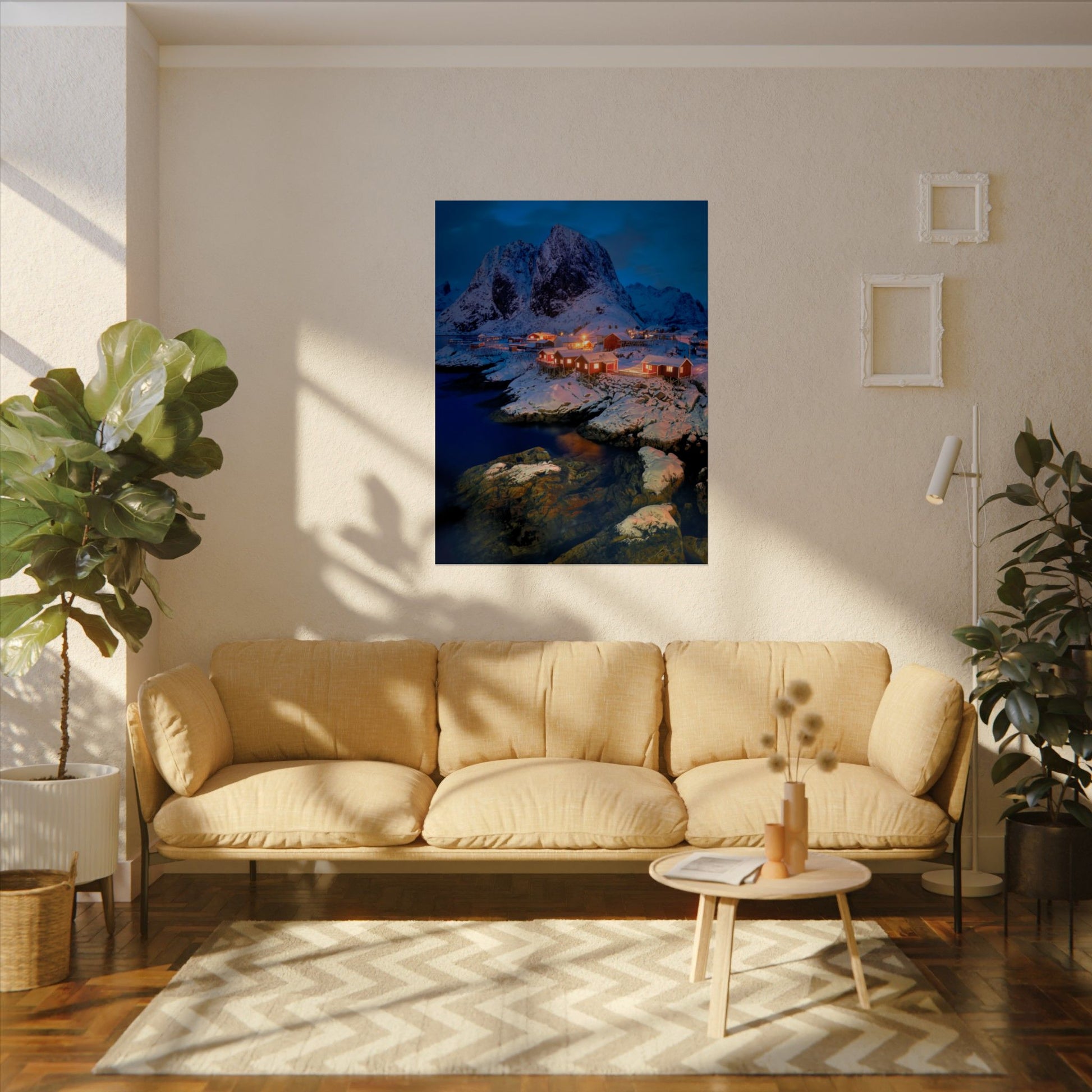 Living room with beige sofa, coffee table, and wall art of a mountain landscape.